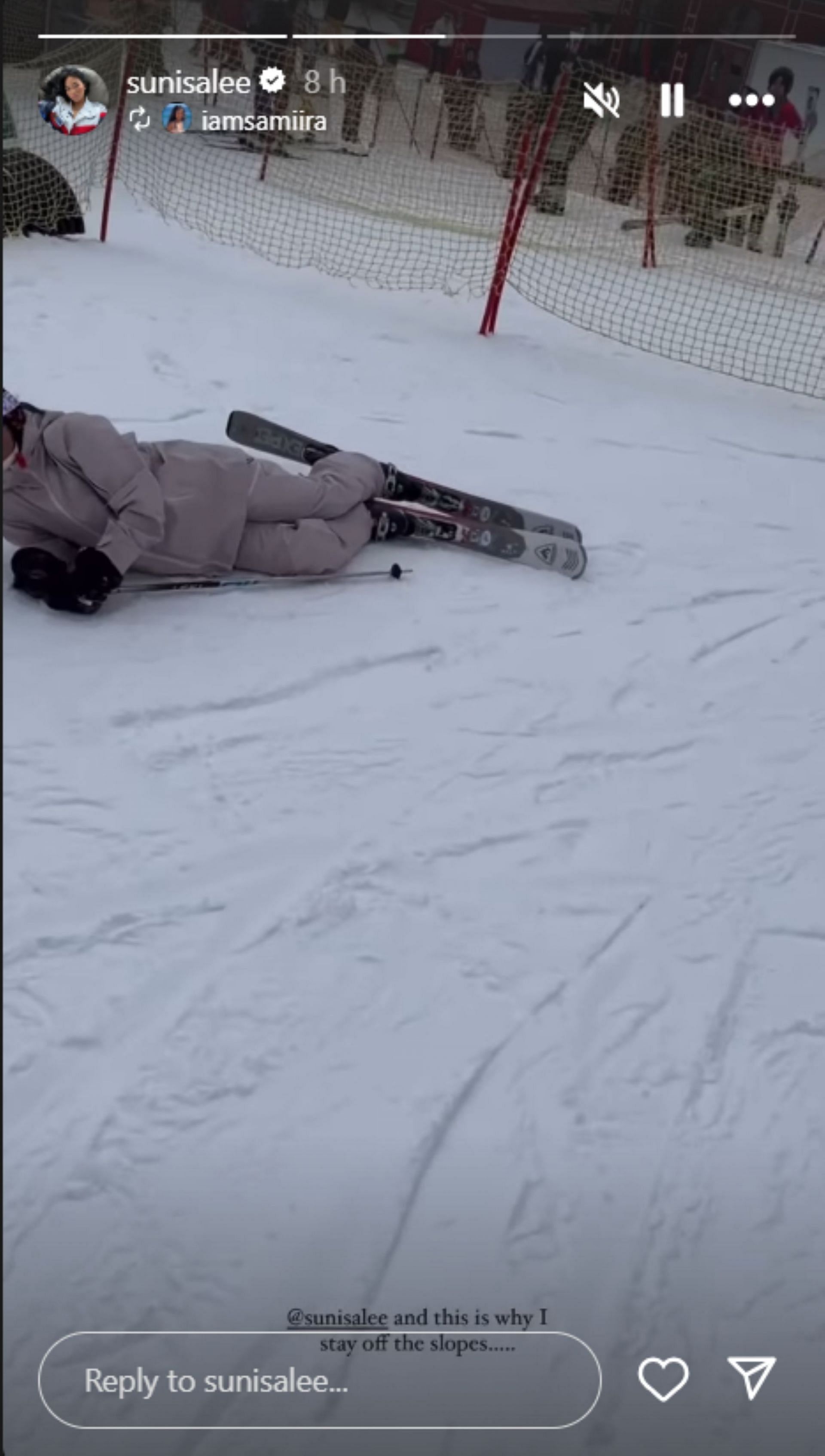 Suni Lee lies on the slope amid skiing; Instagram - @sunisalee