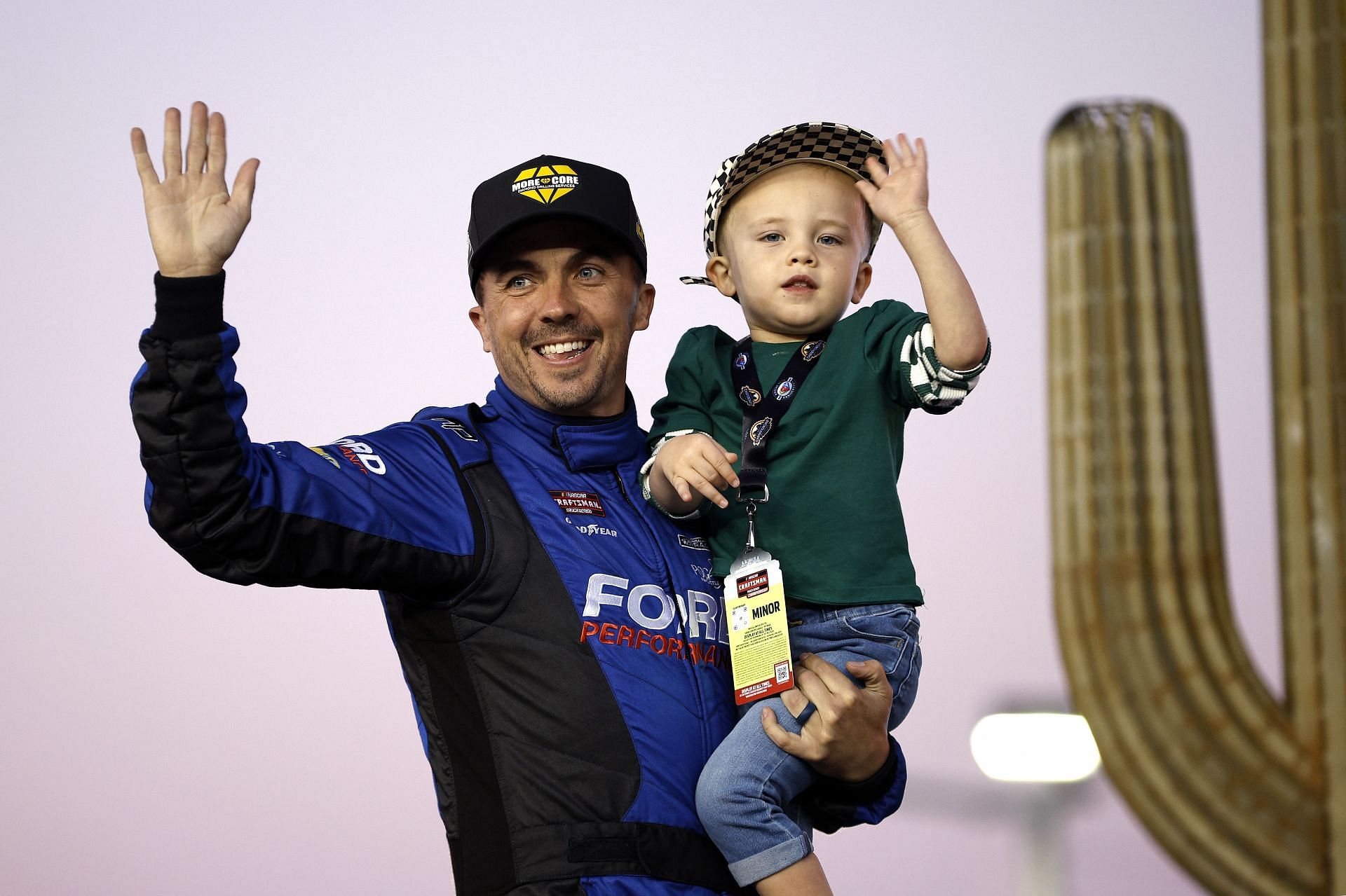 AVONDALE, ARIZONA - NOVEMBER 08: Frankie Muniz, driver of the #27 More Core Diamond Drilling Ford, waves to fans as he walks onstage during driver intros prior to the NASCAR Craftsman Truck Series Championship Race at Phoenix Raceway on November 08, 2024 in Avondale, Arizona. (Photo by Sean Gardner/Getty Images) - Source: Getty