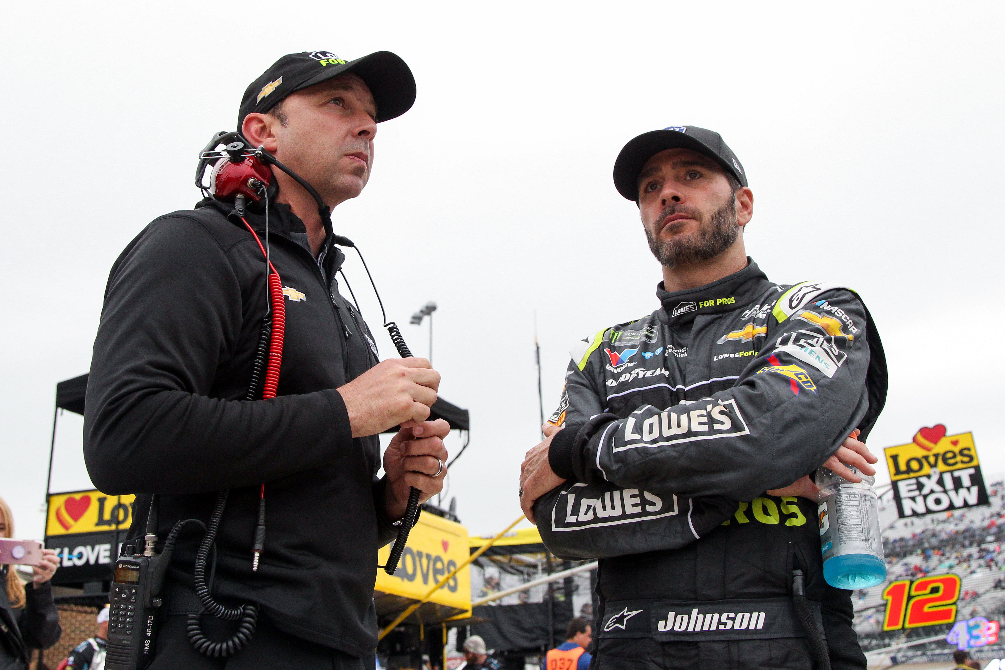 Jimmie Johnson (right) stands with crew chief Chad Knaus (left) at Dover International Speedway. - Source: Imagn