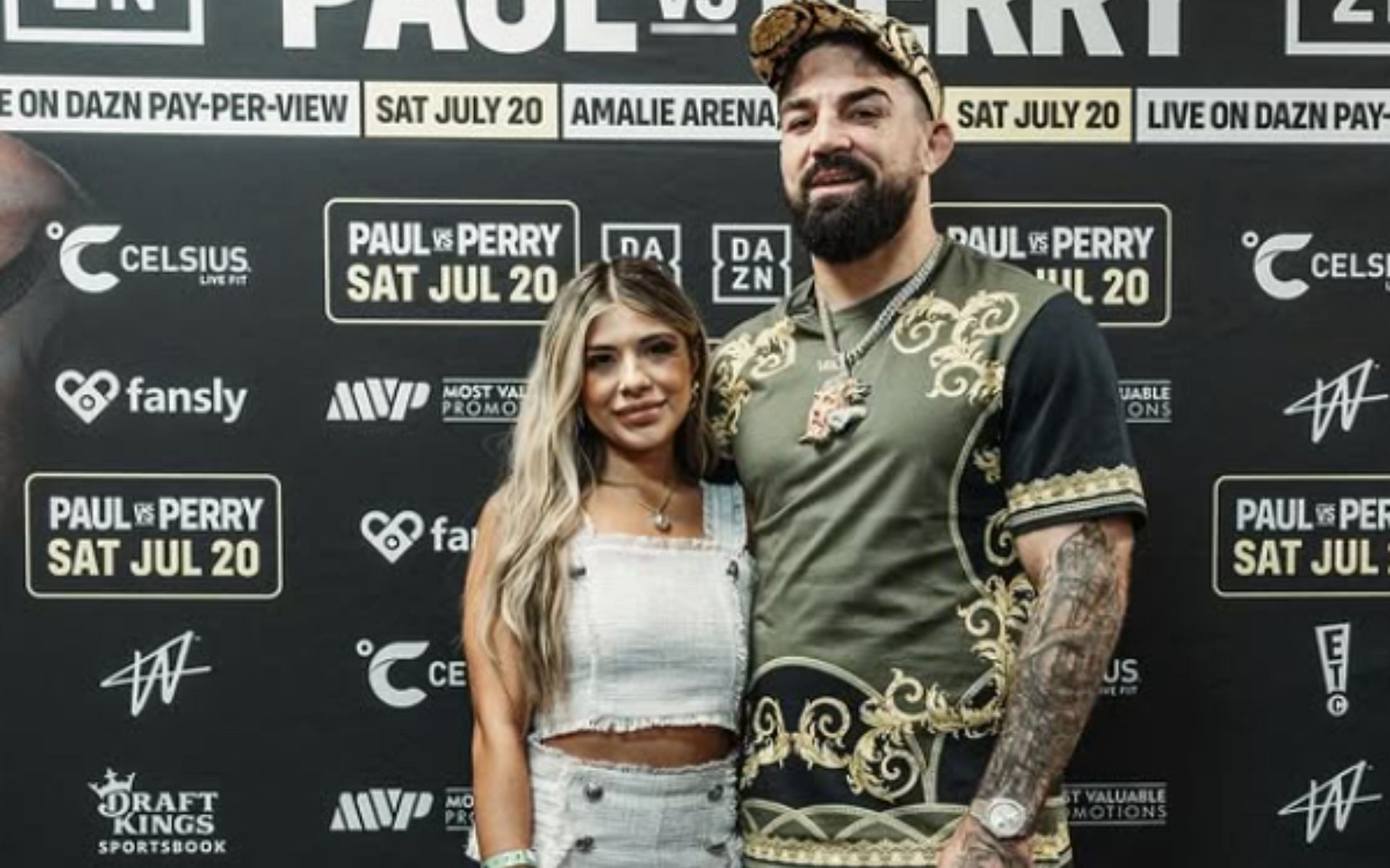 Mike Perry (right) shares humorous video of teaching wife Latory Perry (left) on how to do a perfect Rear Naked choke. [Image courtesy:@latoryperry on Instagram] @