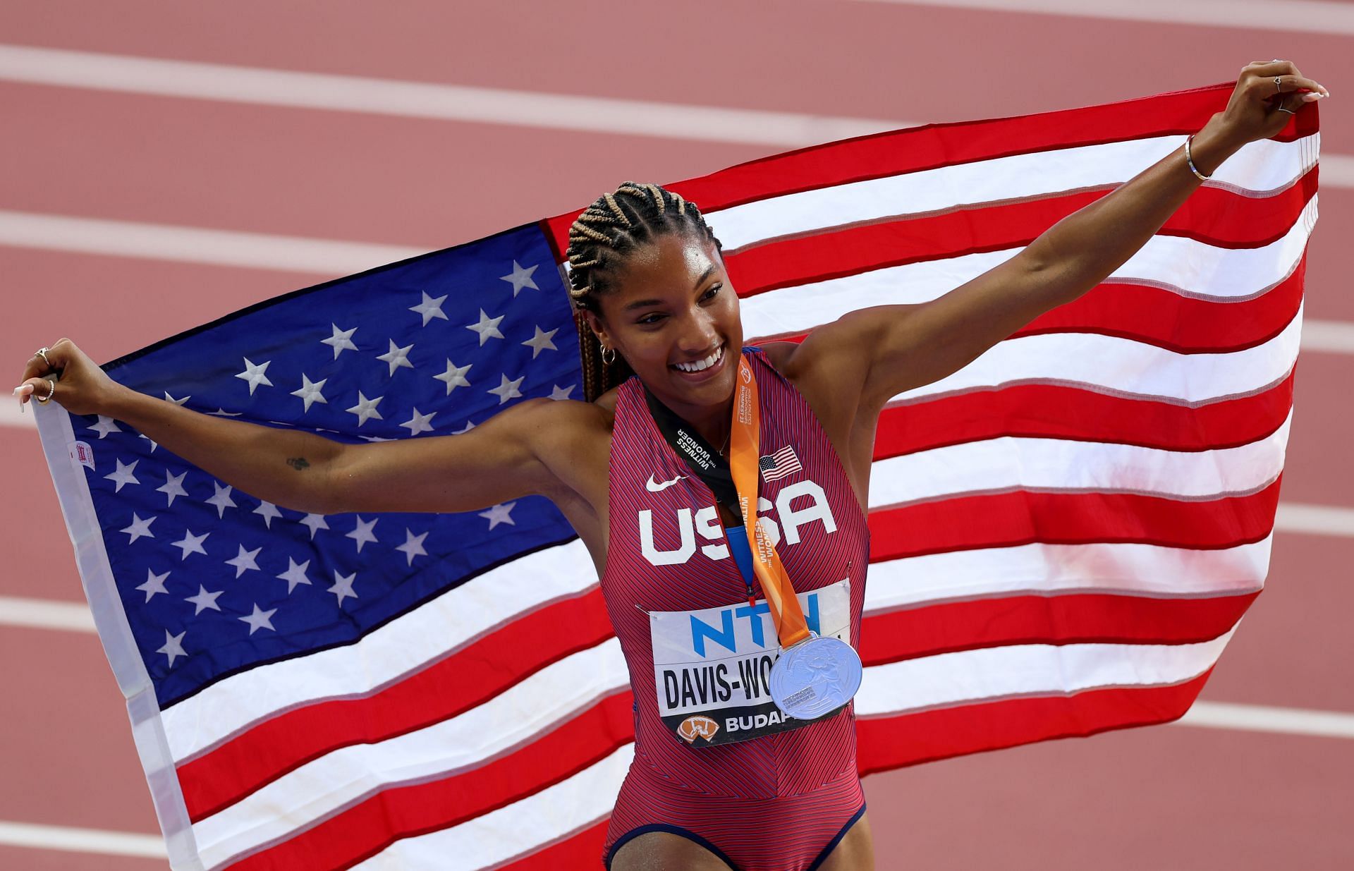 Davis-Woodhall celebrating with her silver medal at the 2023 World Championships (Image via: Getty Images)