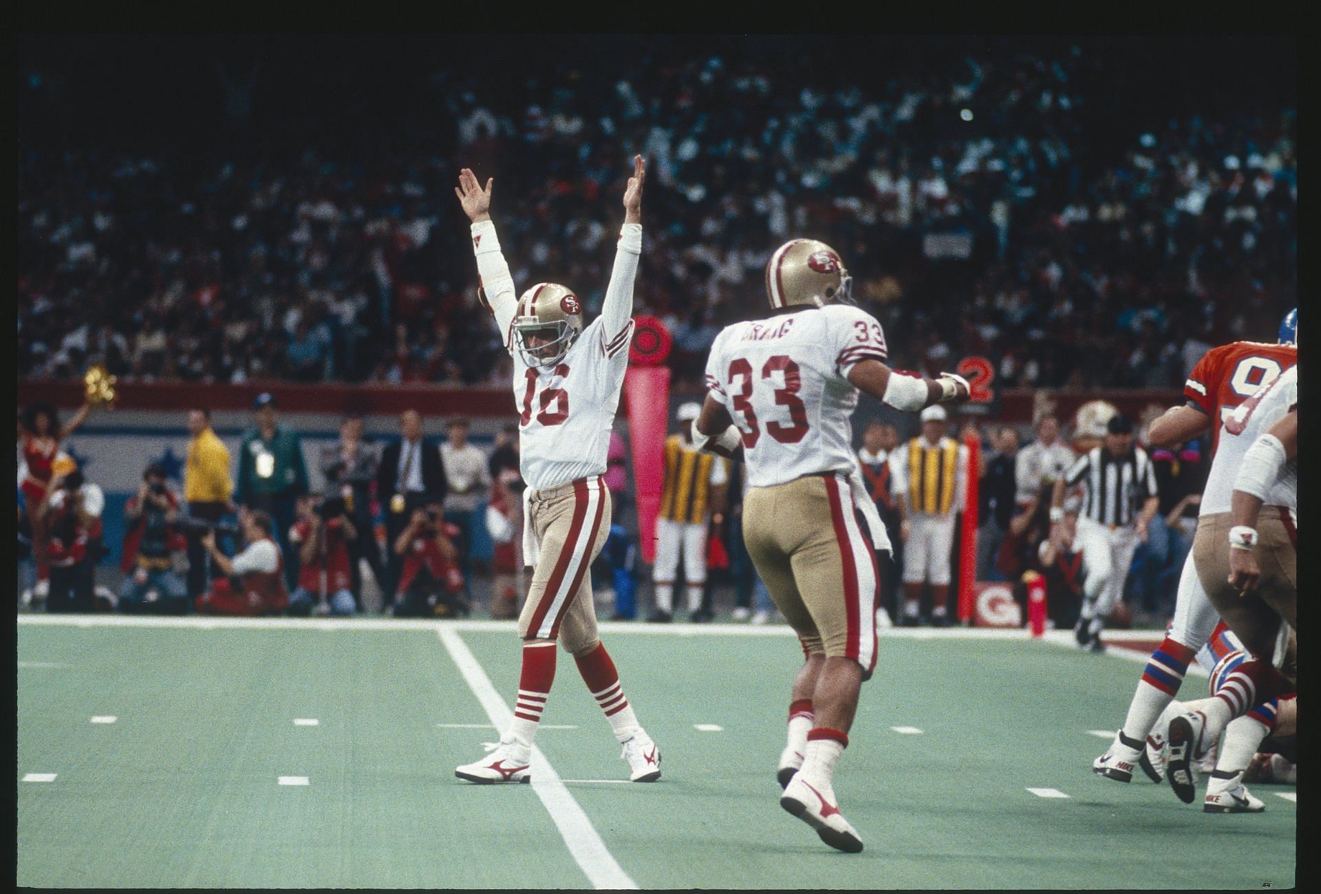 Joe Montana #16 of the San Francisco 49ers celebrates after the 49ers scored against the Denver Broncos during Super Bowl XXIV on January 22, 1990 at the Super Dome in New Orleans, LA. - Source: Getty