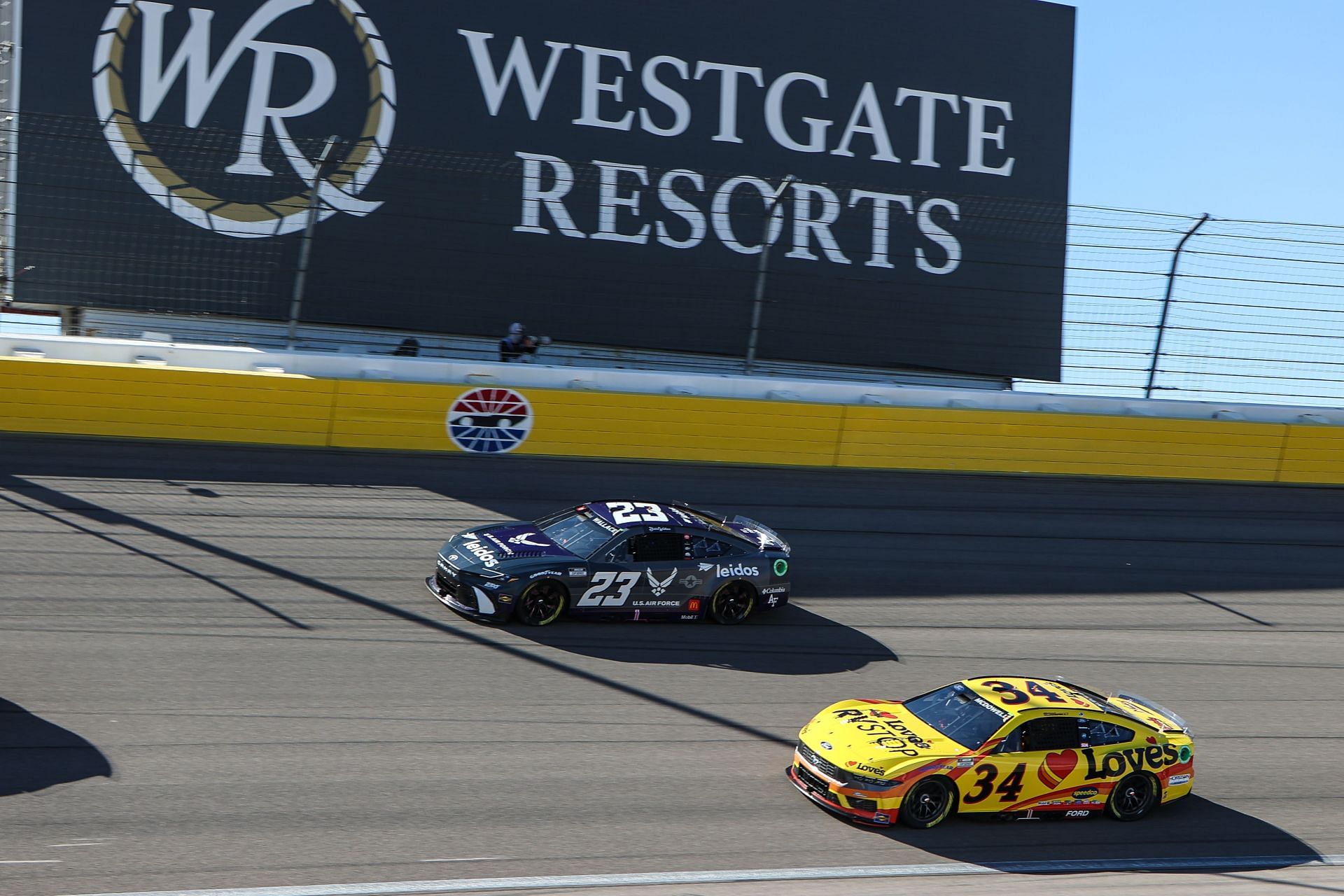 Bubba Wallace (#23 23XI Racing Leidos/U.S. Air Force Toyota) and Michael McDowell (#34 Front Row Motorsports Love&#039;s Travel Stops Ford) race during the South Point 400 NASCAR Cup Series - Source: Getty