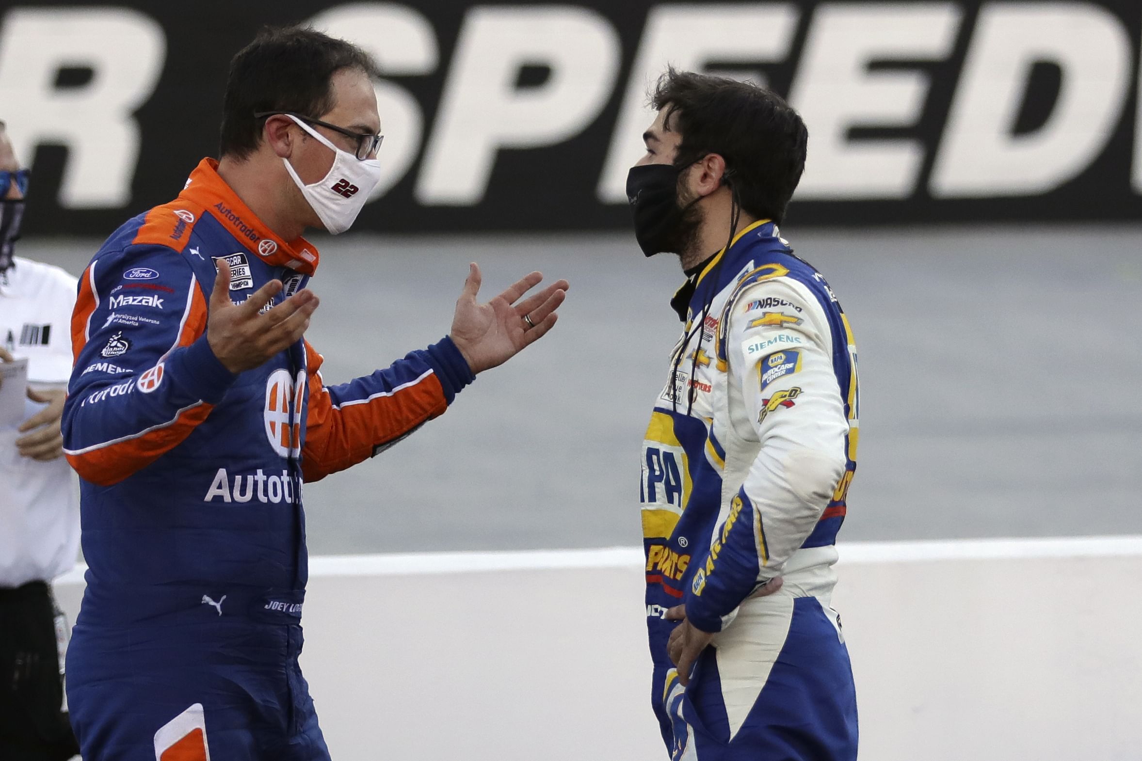 Joey Logano (left) and driver Chase Elliott (right) talk after the NASCAR Cup Series race at Bristol Motor Speedway. - Source: Imagn