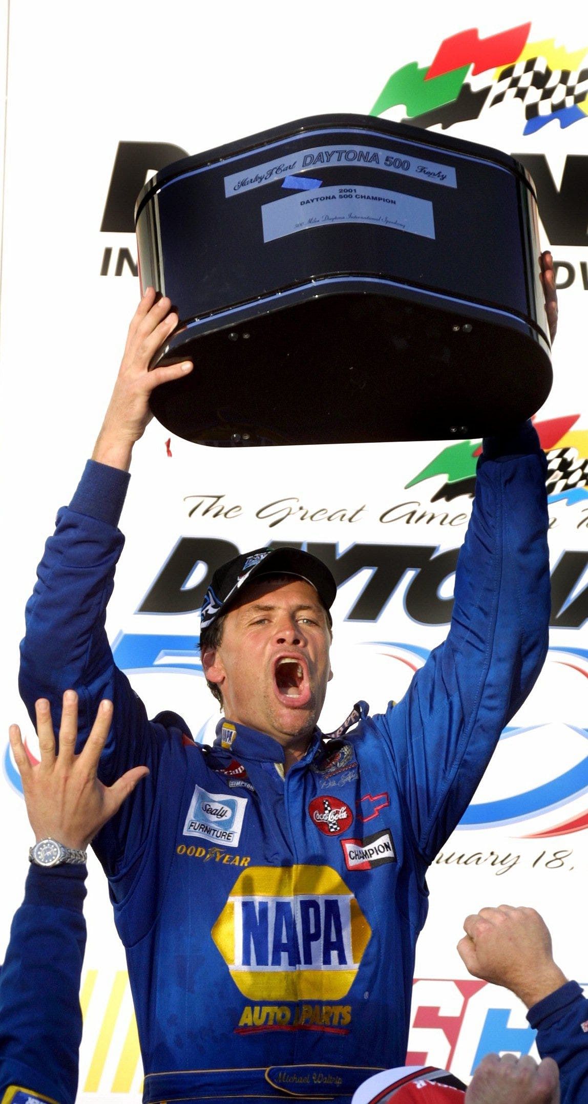 Michael Waltrip lifts the champion&#039;s trophy after winning the Daytona 500 on February 18, 2001  - Source: Imagn