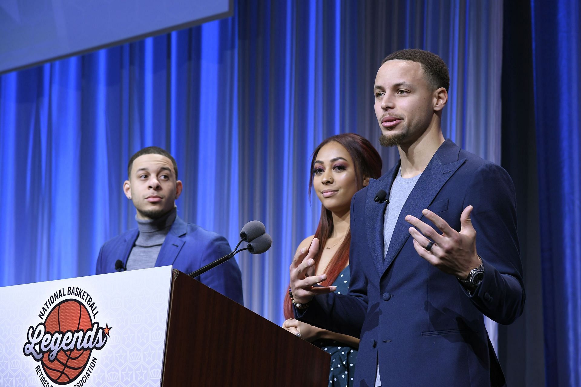 : Seth and Sydel Curry listen as their brother Steph Curry gets ready to present the Home Town Hero award to their father Dell Curry - Source: Getty