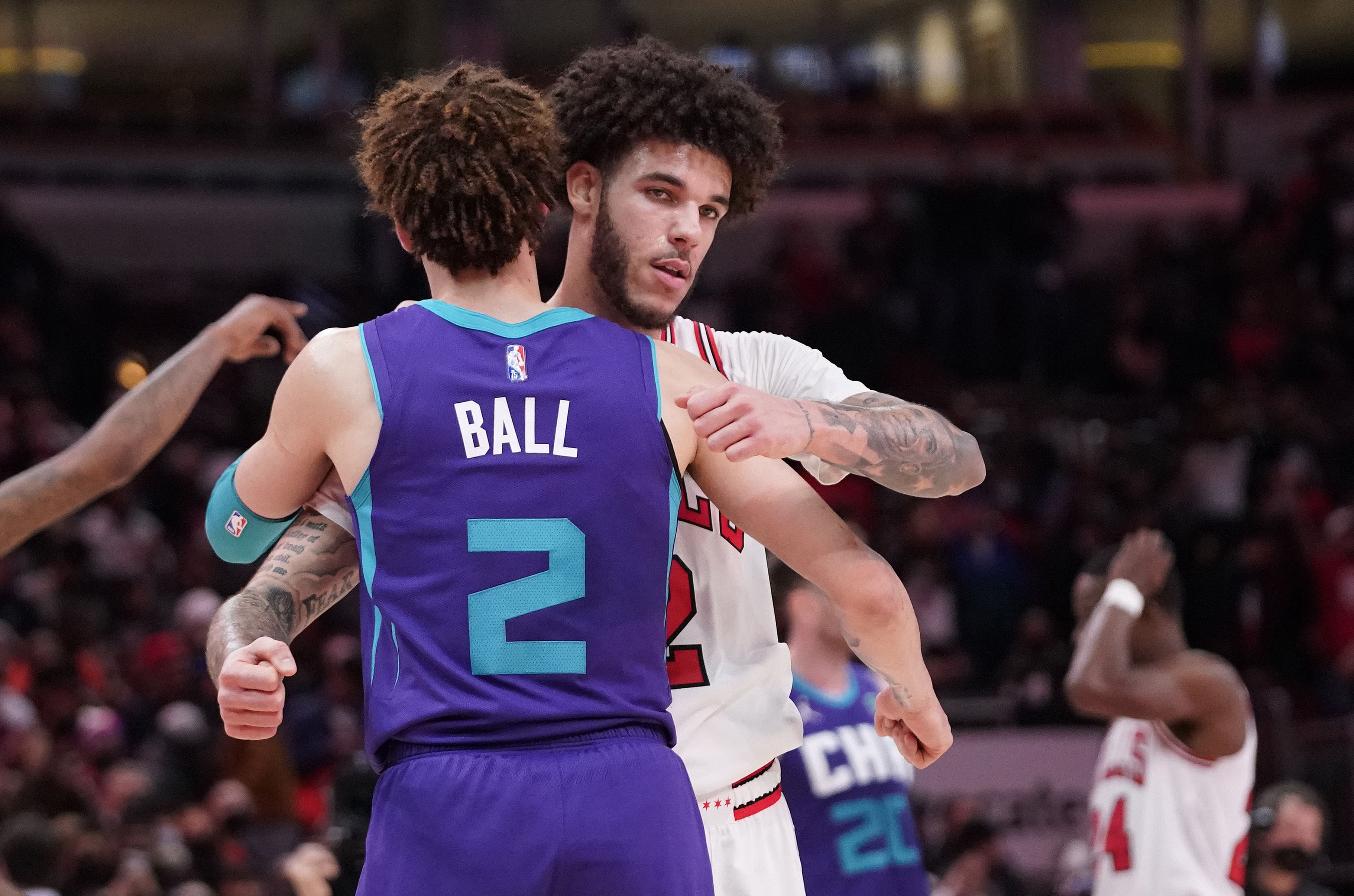 Charlotte Hornets guard LaMelo Ball (2) and Chicago Bulls guard Lonzo Ball (2) hug after the game at United Center. - Source: Imagn