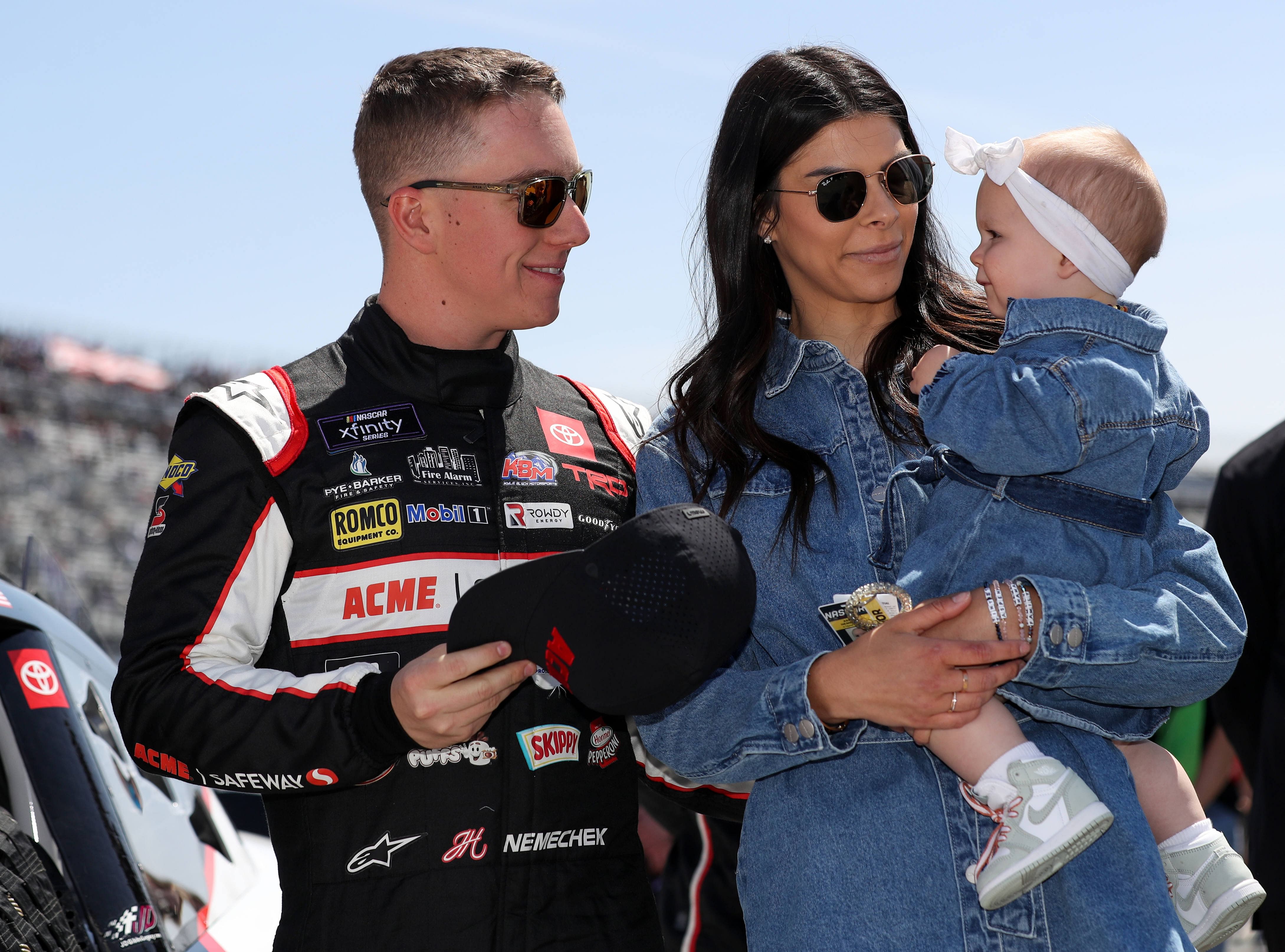 Apr 30, 2022; Dover, Delaware, USA; NASCAR Xfinity Series driver John Hunter Nemechek stands with his wife Taylor Nemechek and daughter Aspen Nemechek on pit road prior to the A-Game 200 at Dover Motor Speedway. Mandatory Credit: Matthew OHaren-Imagn Images - Source: Imagn