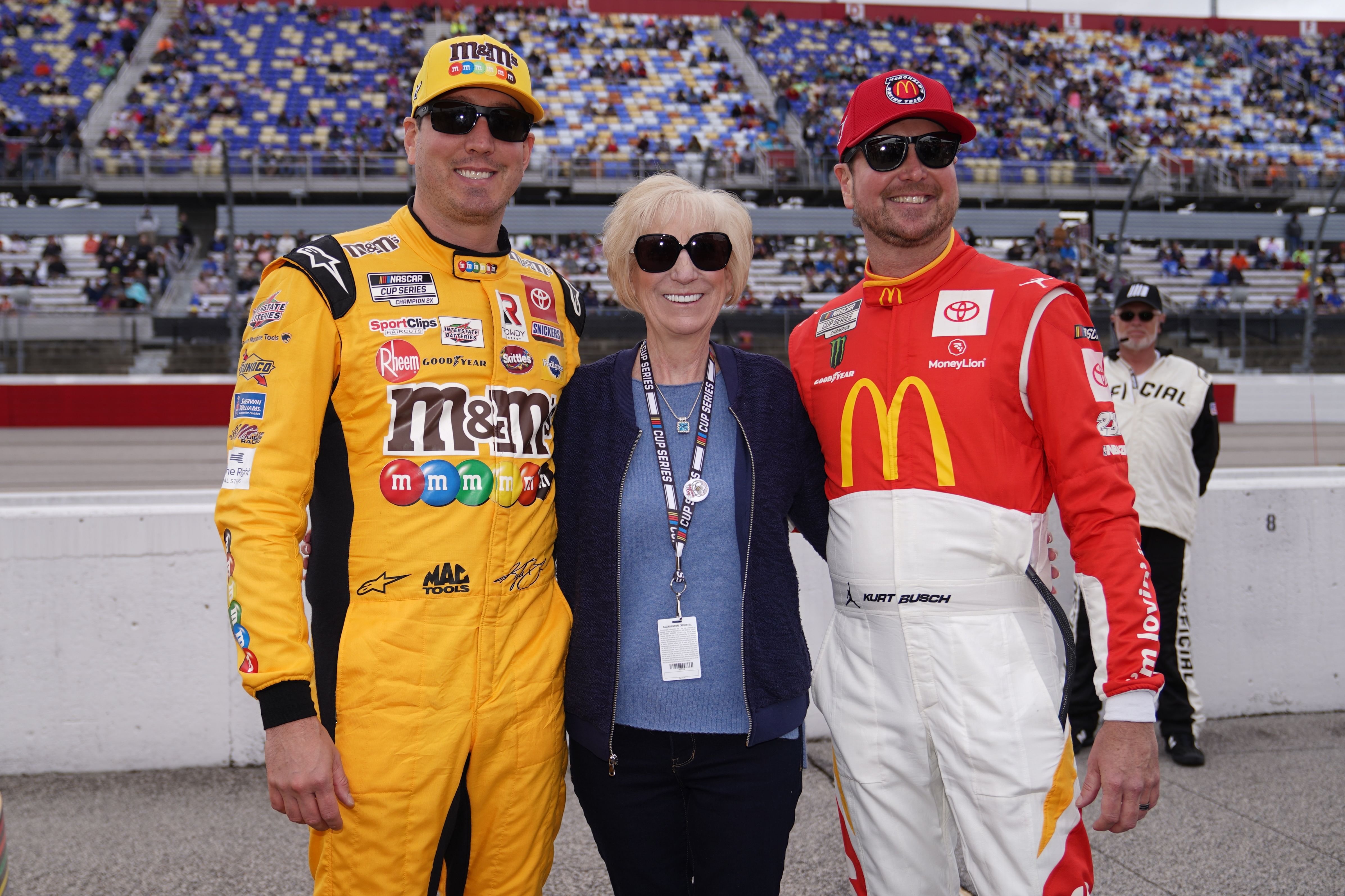 NASCAR Cup Series driver Kyle Busch (L) poses for a picture with his mother Gaye Busch (C) and brother Kurt Busch (R) - Source: Imagn