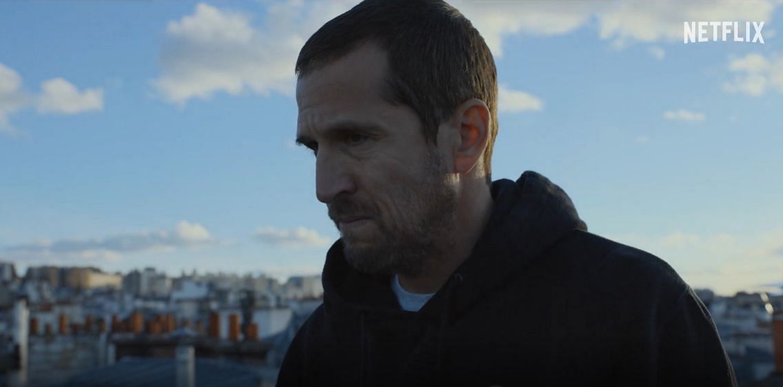 Man standing with a blue sky behind