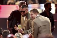 Travis Kelce of the Kansas City Chiefs and Rob Gronkowski of the Tampa Bay Buccaneers chat at the NFL Honors show at the YouTube Theater on February 10, 2022 in Inglewood, California. - Source: Getty