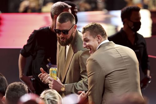 Travis Kelce of the Kansas City Chiefs and Rob Gronkowski of the Tampa Bay Buccaneers chat at the NFL Honors show at the YouTube Theater on February 10, 2022 in Inglewood, California. - Source: Getty