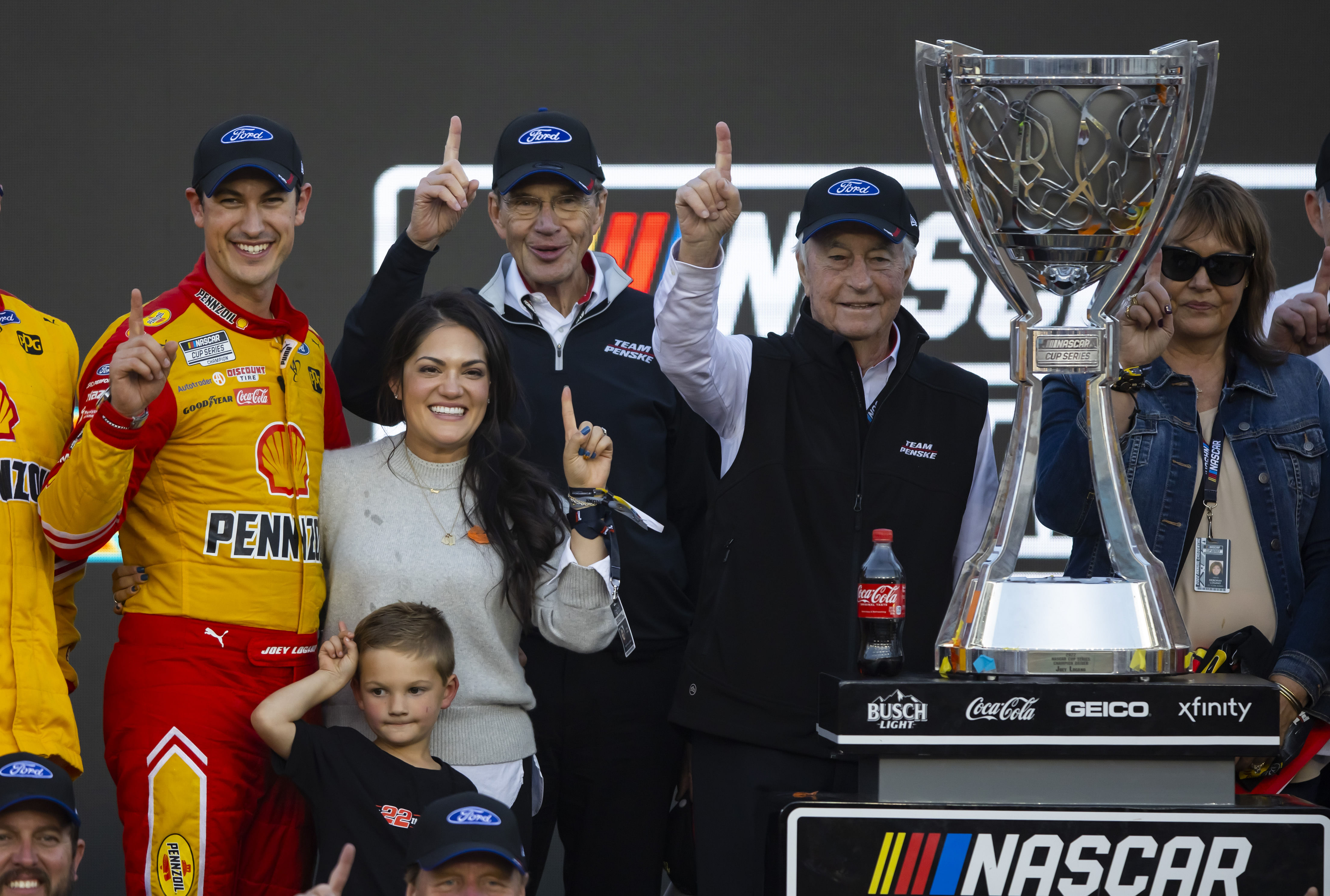 NASCAR Cup Series driver Joey Logano celebrates with team owner Roger Penske after winning the Cup Championship at Phoenix Raceway. - Source: Imagn