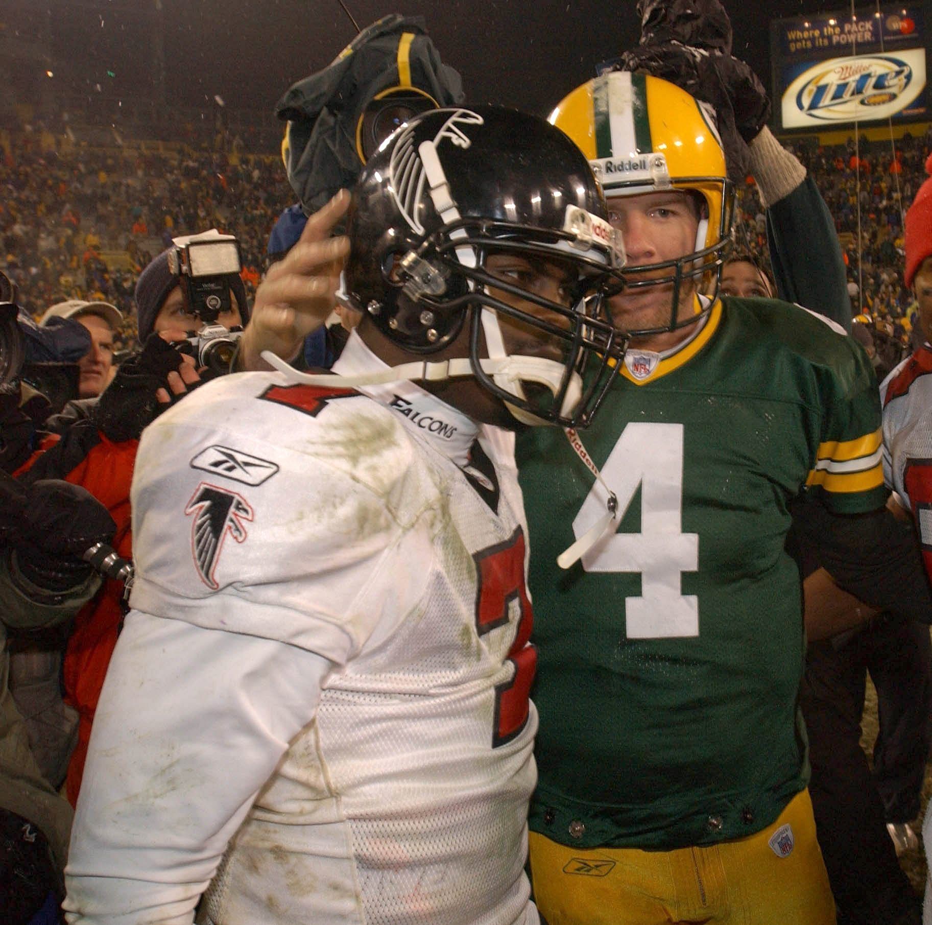 Green Bay Packers Brett Favre (right) and Atlanta Falcons Michael Vick meet on the field following their game Saturday, January 4, 2003 at Lambeau Field in Green Bay - Source: Imagn