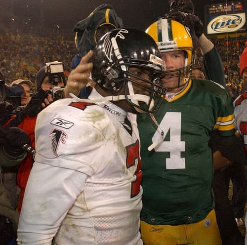 Green Bay Packers Brett Favre (right) and Atlanta Falcons Michael Vick meet on the field following their game Saturday, January 4, 2003 at Lambeau Field in Green Bay - Source: Imagn