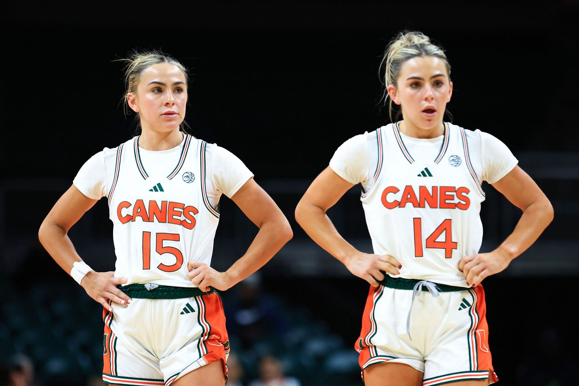 Hanna Cavinder (No. 15) and Haley Cavinder of the Miami Hurricanes look on against the North Carolina Tar Heels during their game on Dec. 29 in Coral Gables, Florida. Photo: Getty