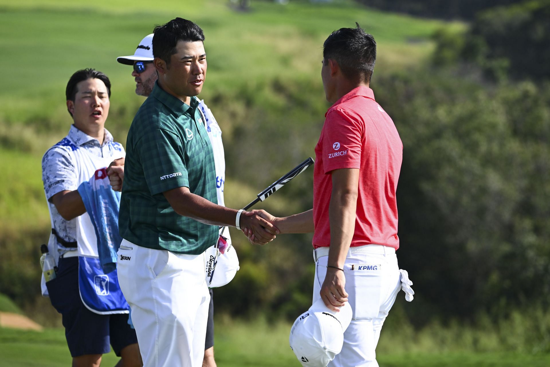 Hideki Matsuyama shakes hands with Collin Morikawa during the third round of The Sentry 2025 (Image Source: Getty)