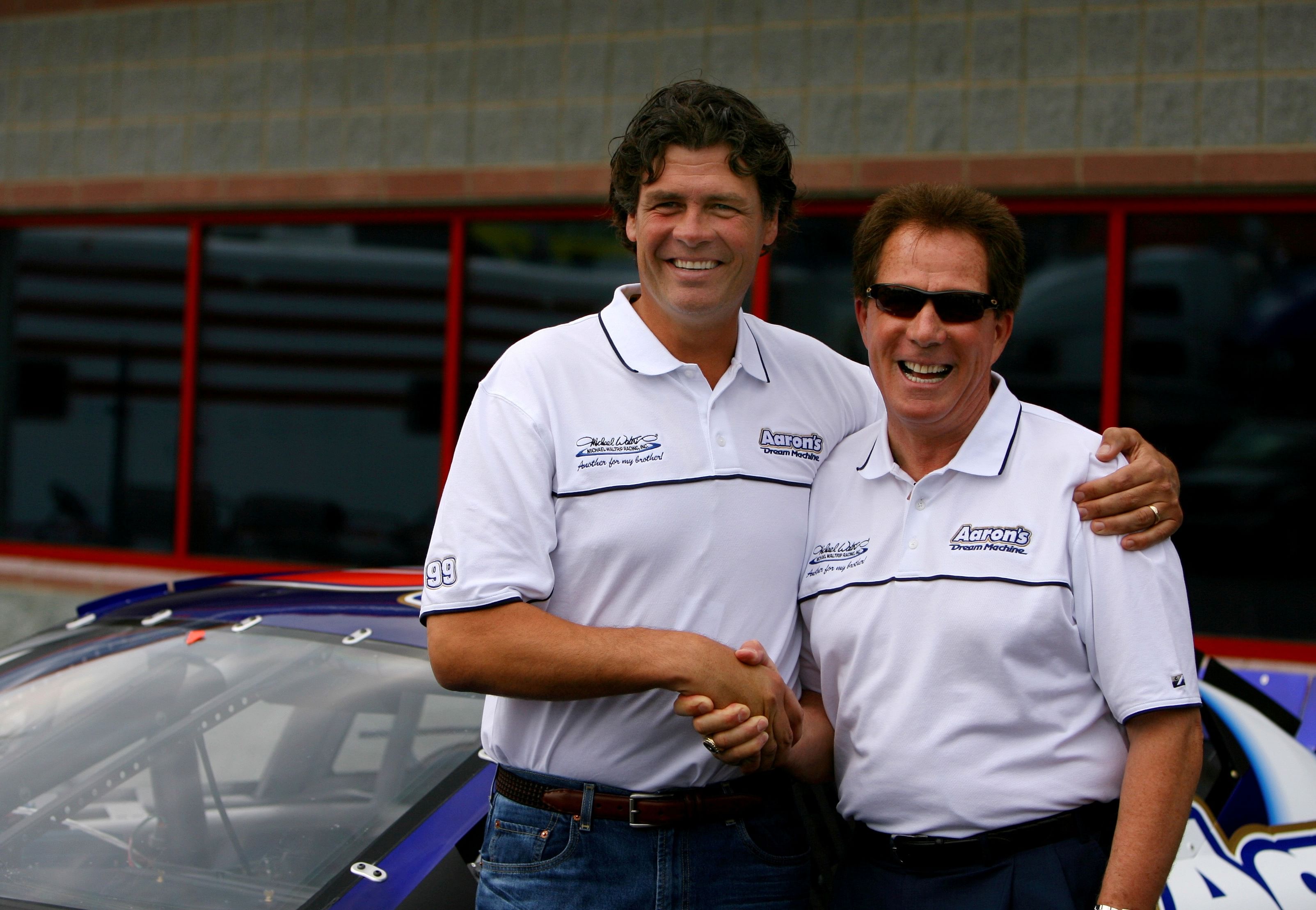 Nascar Nextel Cup driver Michael Waltrip poses with his brother Darrell Waltrip - Source: Imagn