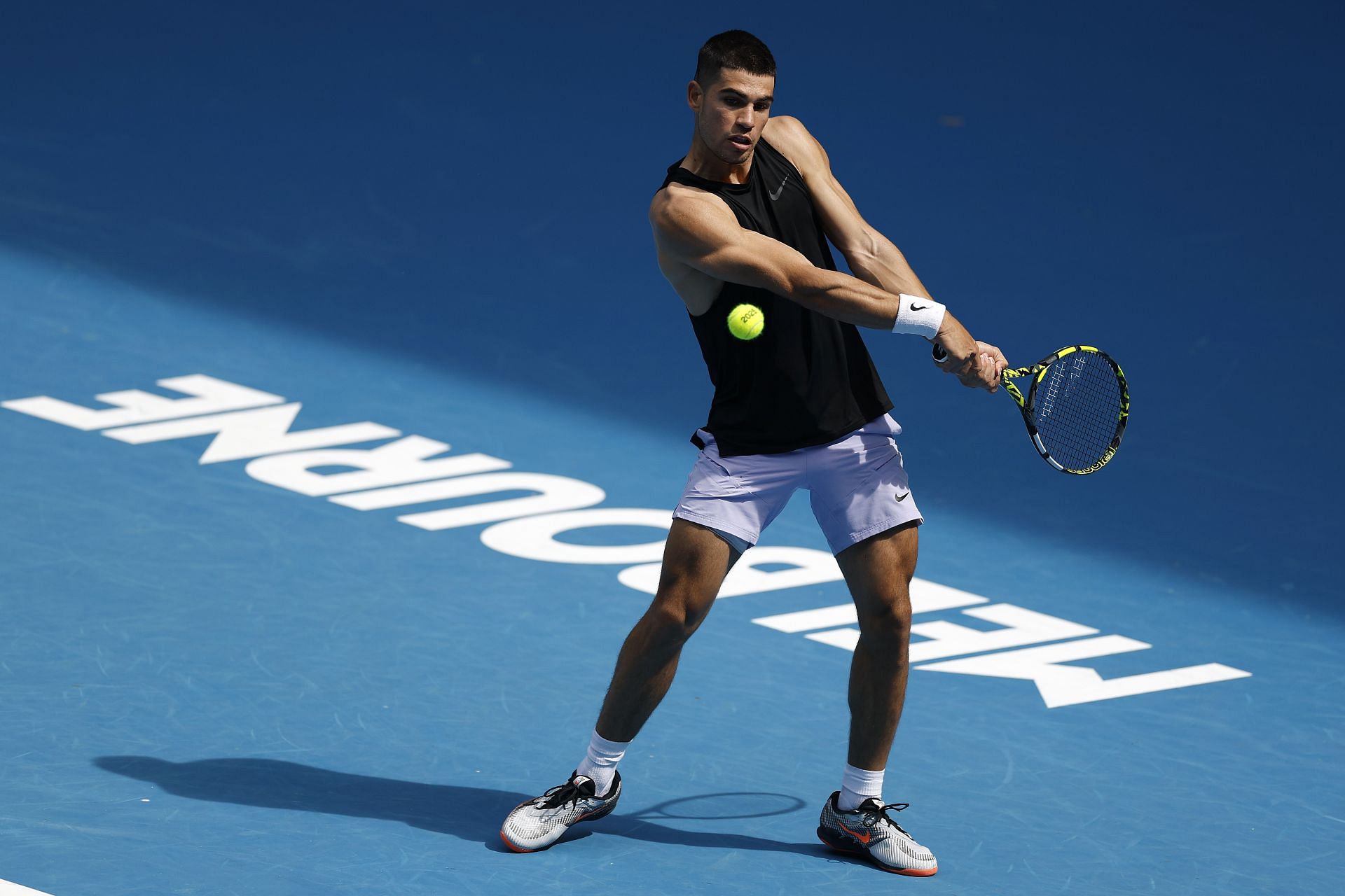 Carlos Alcaraz during a practice session ahead of the 2025 Australian Open (Source: Getty)