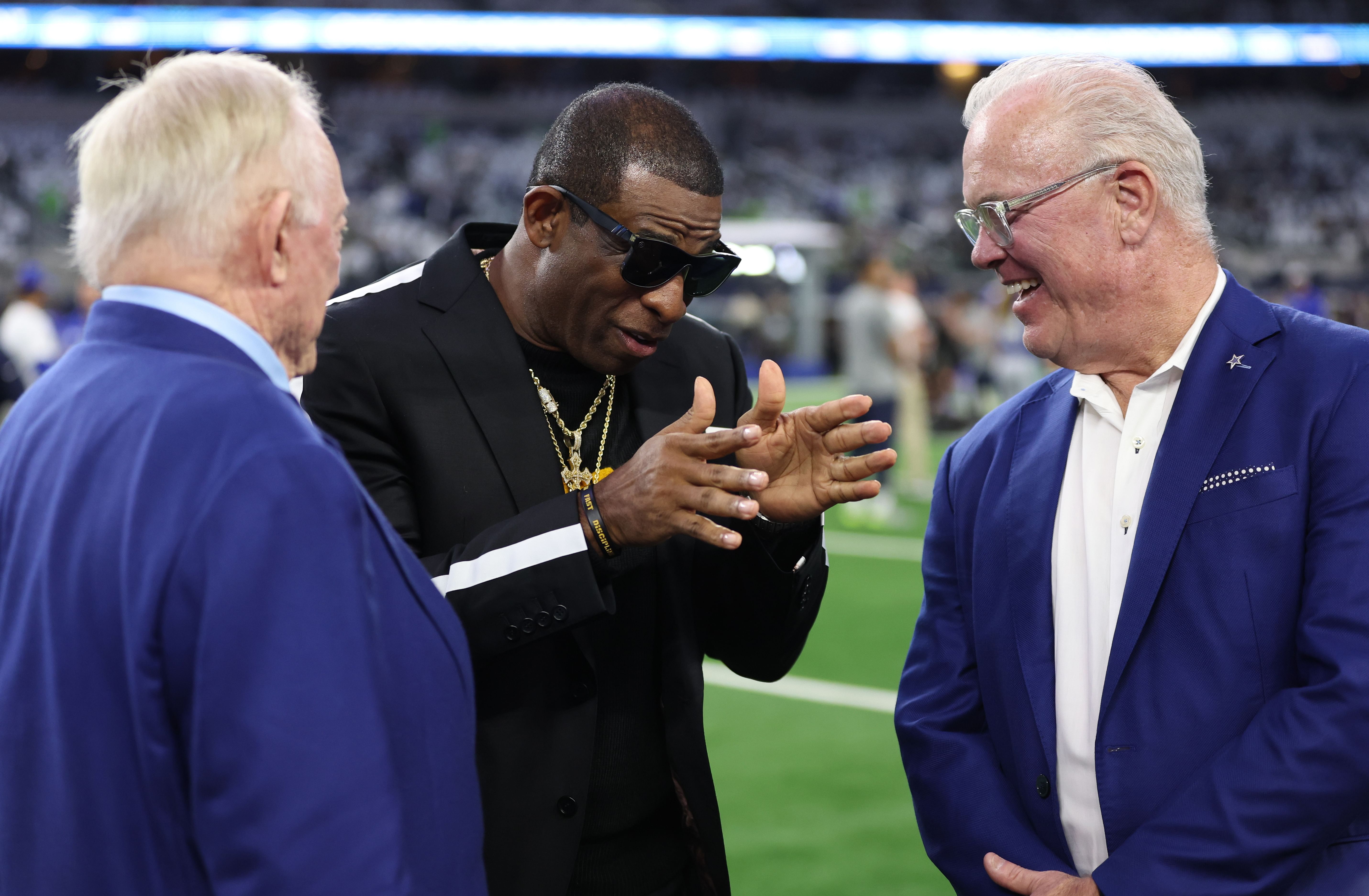 Colorado Buffaloes head coach Deion Sanders (center) talks with Dallas Cowboys owner Jerry Jones (left) and Cowboys CEO Stephen Jones (right) - Source: Imagn