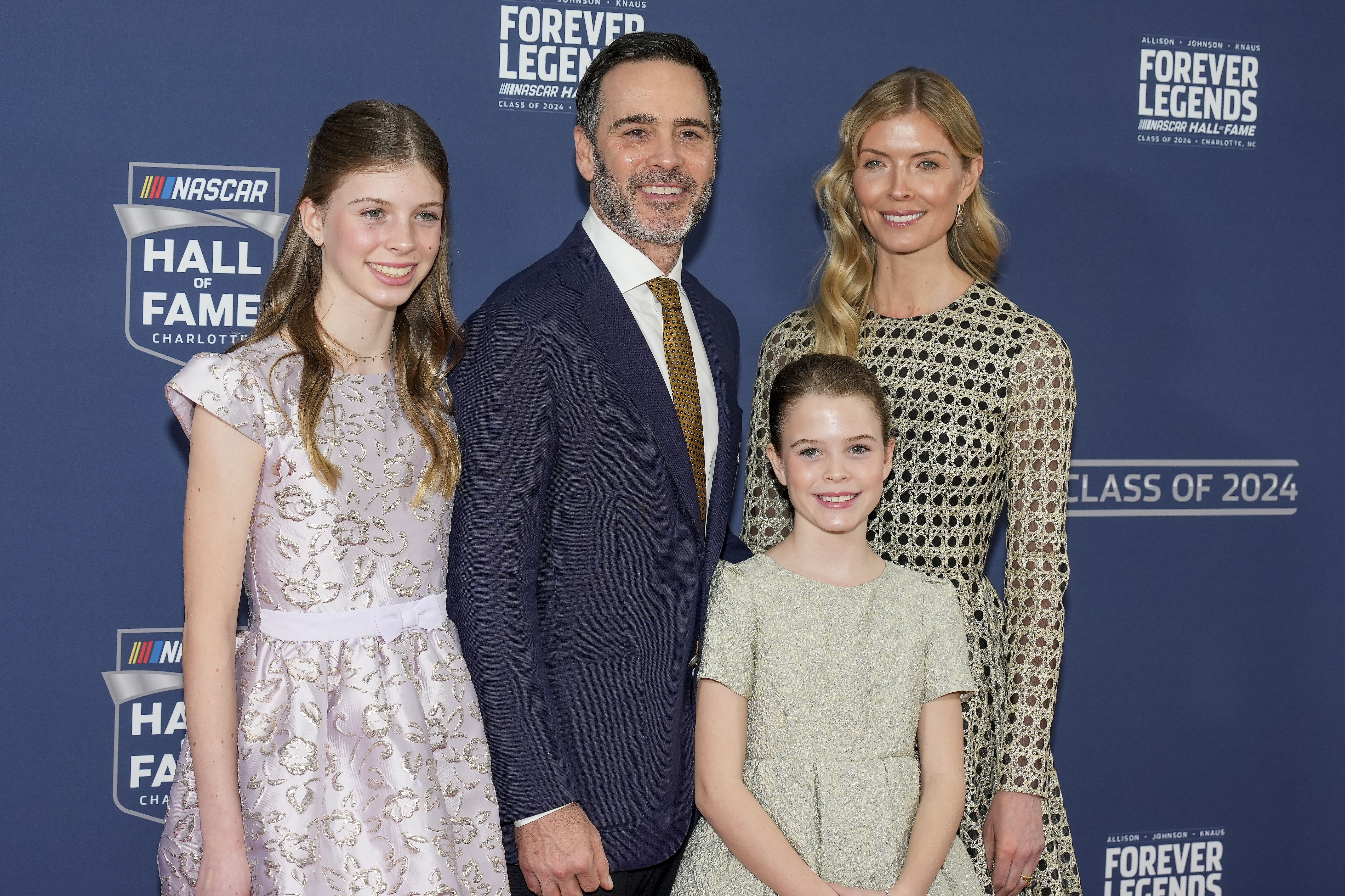 Jimmy Johnson and wife Chandra with daughters Genevieve and Lydia during the red carpet at Charlotte Convention Center Crown Ballroom. Mandatory Credit: Jim Dedmon-Imagn Images.