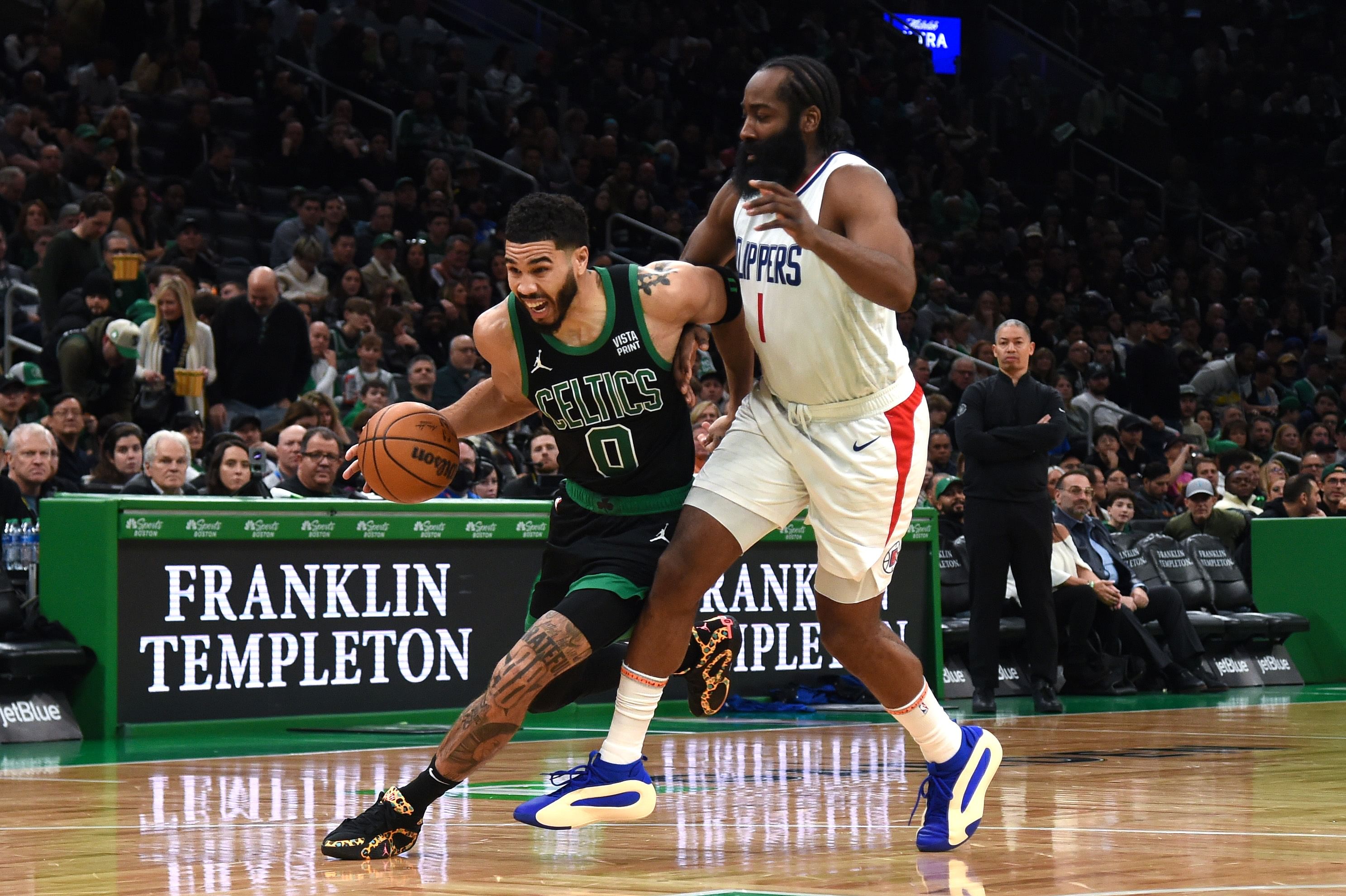 Boston Celtics forward Jayson Tatum controls the ball while LA Clippers guard James Harden defends at TD Garden. Photo Credit: Imagn