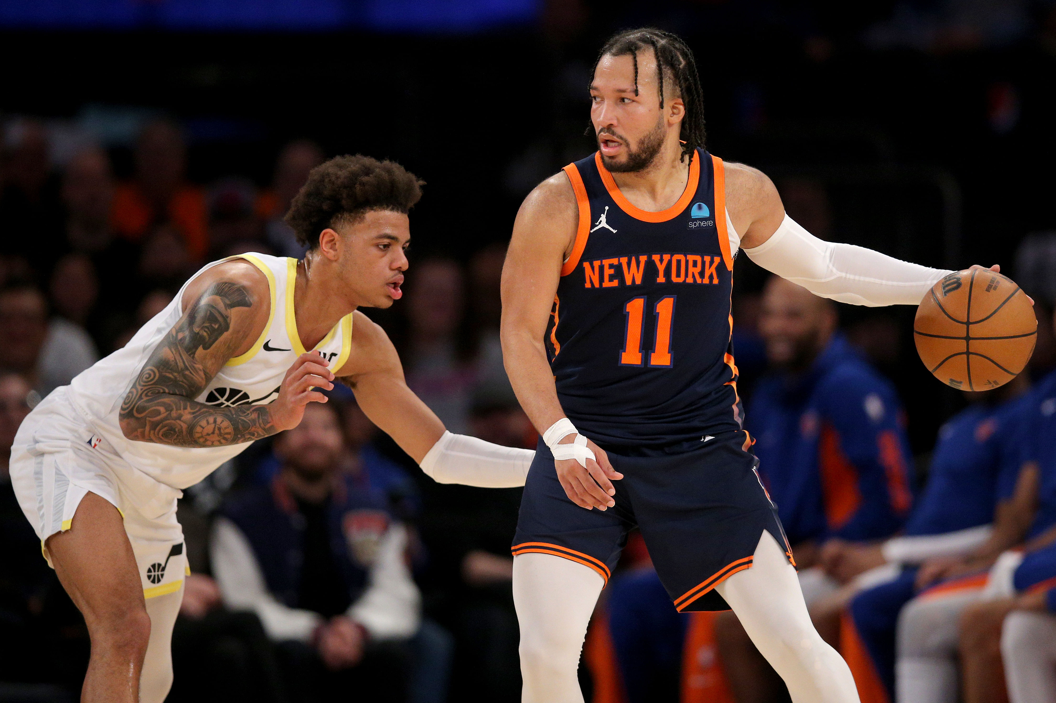 New York Knicks guard Jalen Brunson controls the ball against Utah Jazz guard Keyonte George at Madison Square Garden. Photo Credit: Imagn