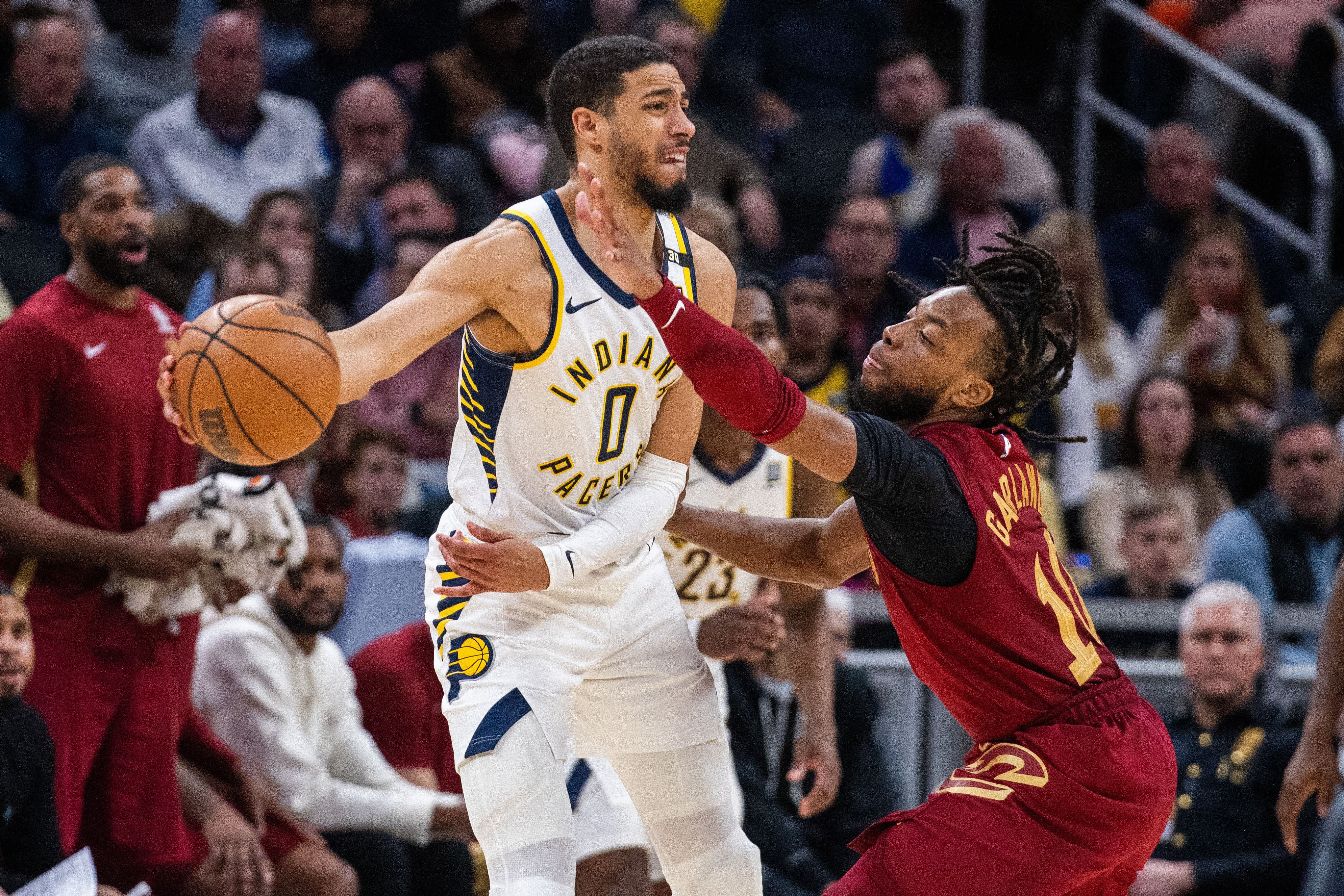 Indiana Pacers guard Tyrese Haliburton passes the ball while Cleveland Cavaliers guard Darius Garland defends at Gainbridge Fieldhouse. Photo Credit: Imagn