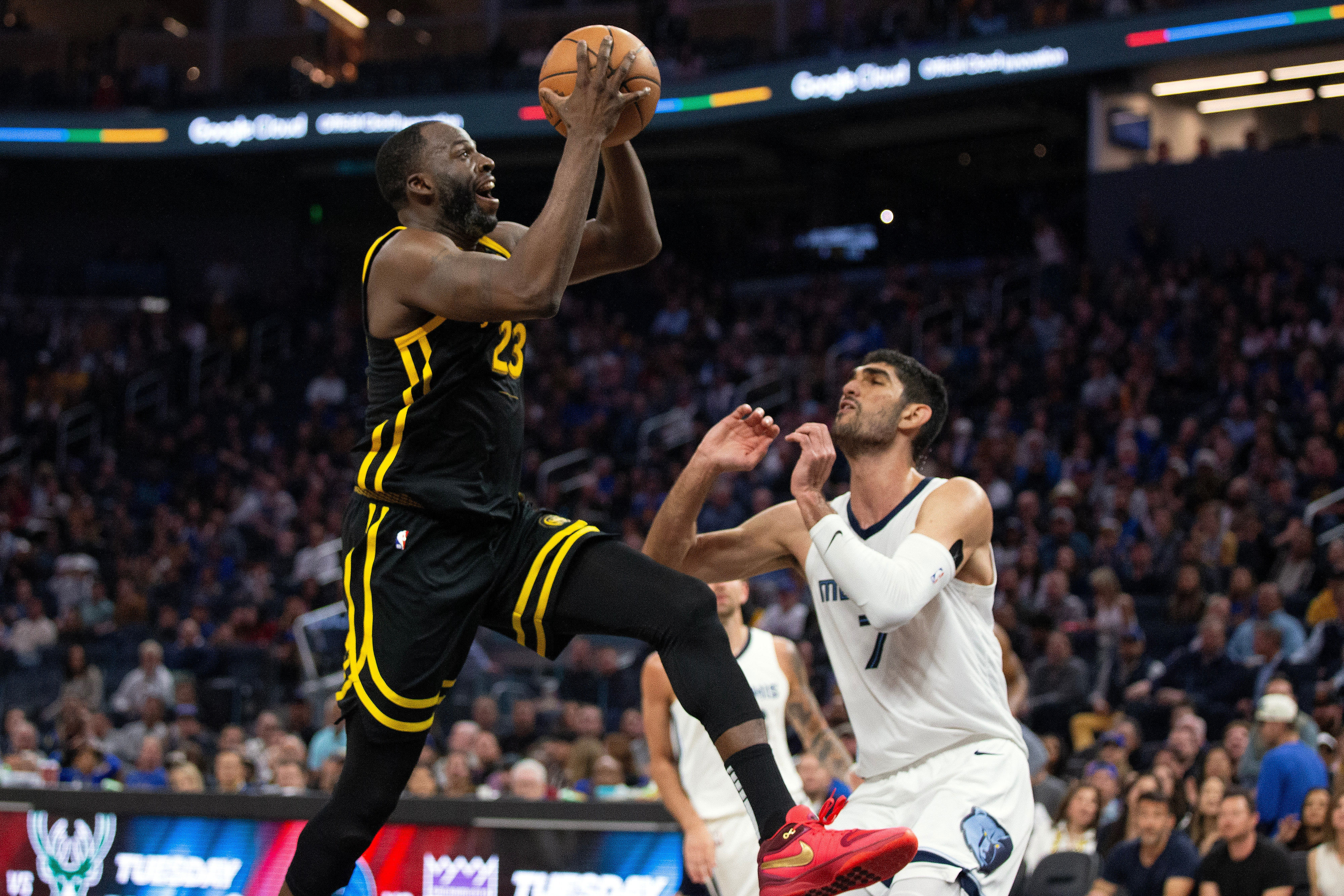 Golden State Warriors forward Draymond Green drives to the basket against Memphis Grizzlies forward Santi Aldama at Chase Center. Photo Credit: Imagn