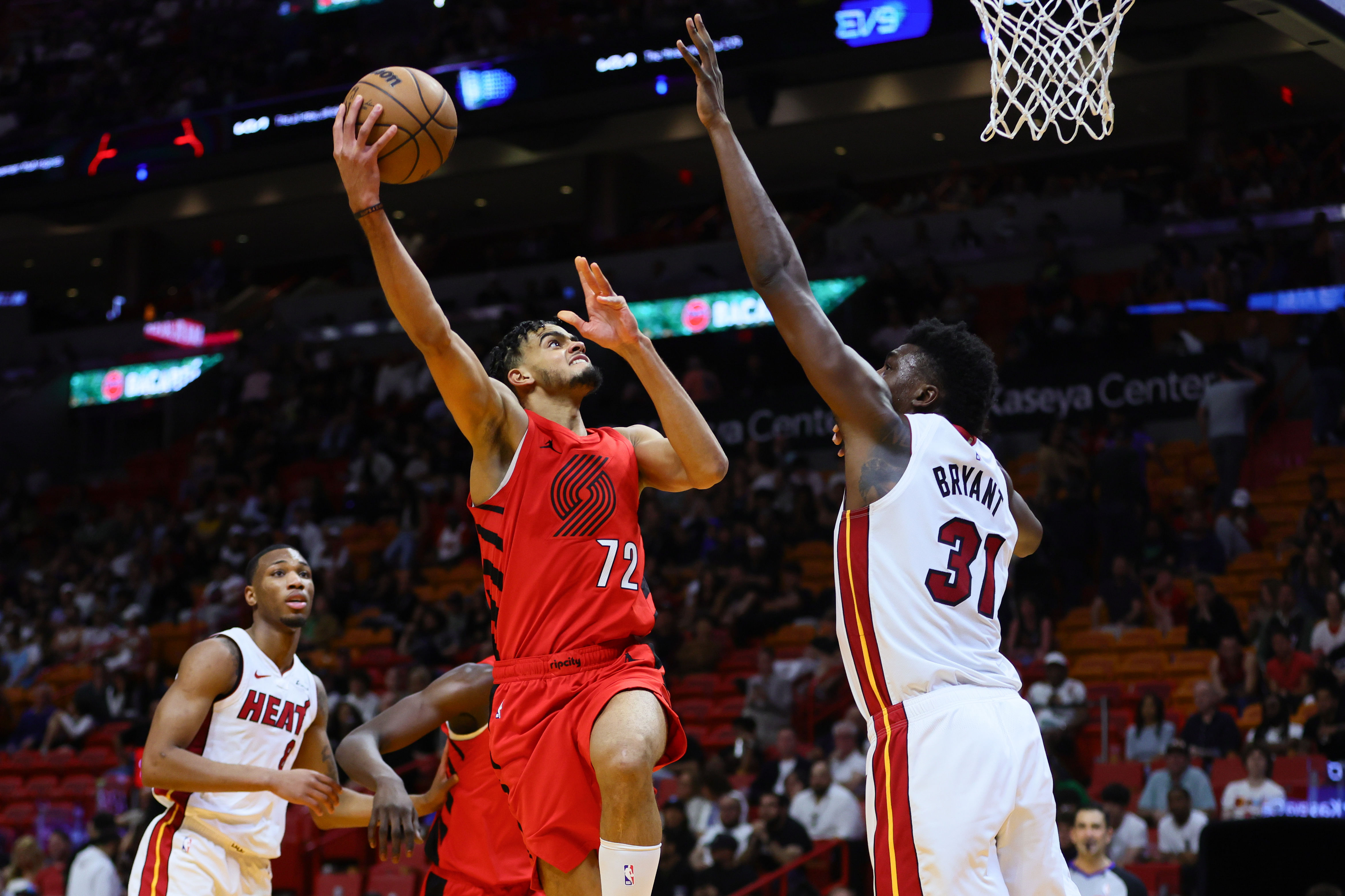 Mar 29, 2024; Miami, Florida, USA; Portland Trail Blazers guard Rayan Rupert (72) drives to the basket against Miami Heat center Thomas Bryant (31) during the fourth quarter at Kaseya Center. Mandatory Credit: Sam Navarro-Imagn Images - Source: Imagn