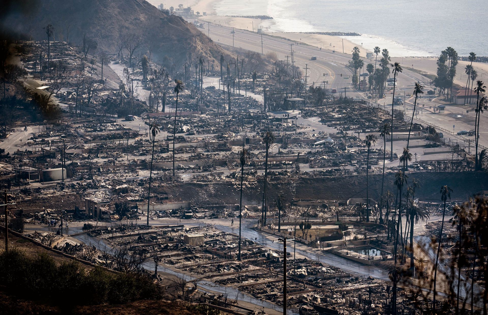 PACIFIC PALISADES, CALIFORNIA: Businesses and homes burnt along - Source: Getty