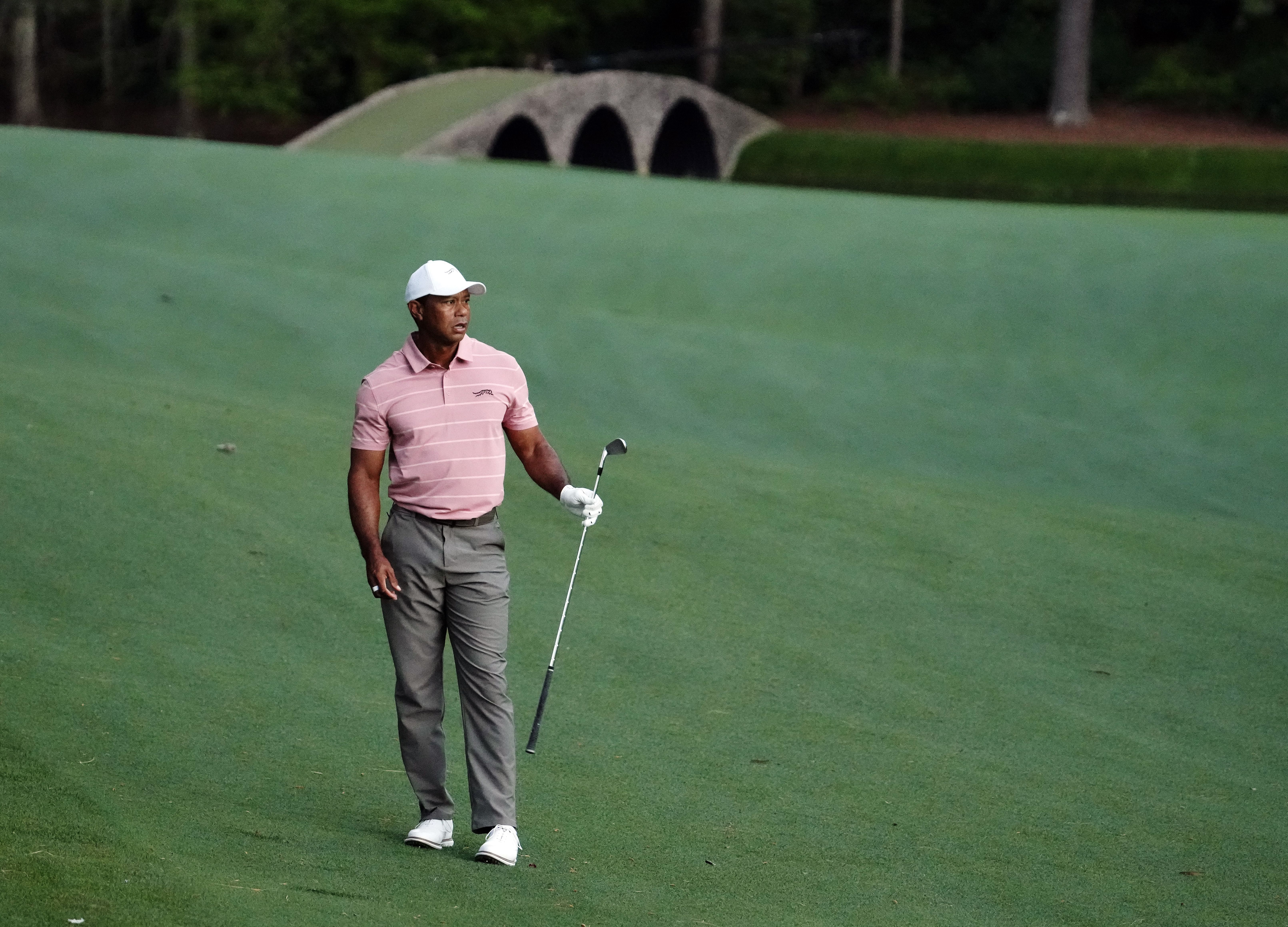 Tiger Woods watches his third shot on No. 13 during the first round of the Masters Tournament. - Source: Imagn