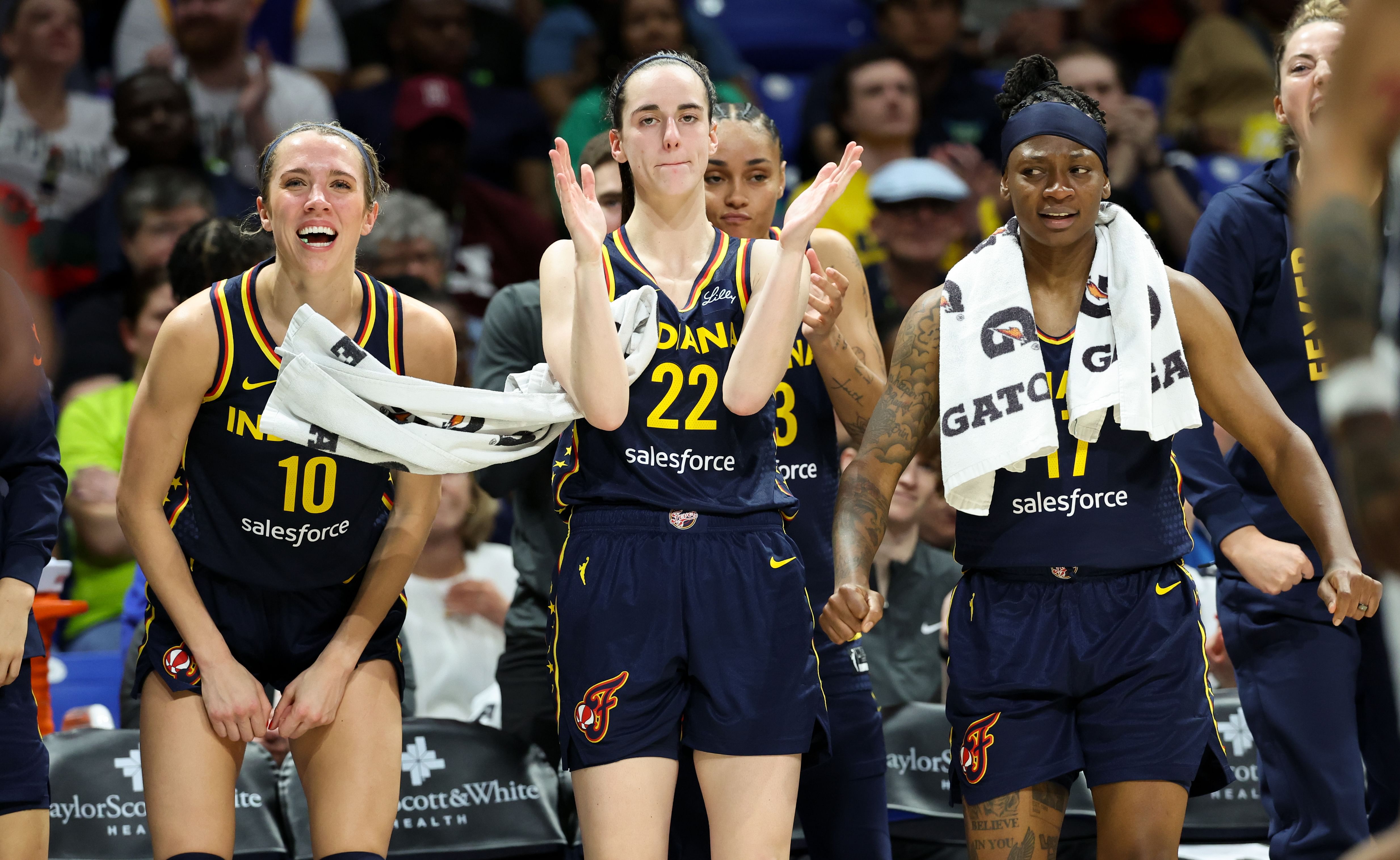 Indiana Fever guards Caitlin Clark, Lexie Hull and Erica Wheeler react during the second half against the Dallas Wings at College Park Center. Photo Credit: Imagn