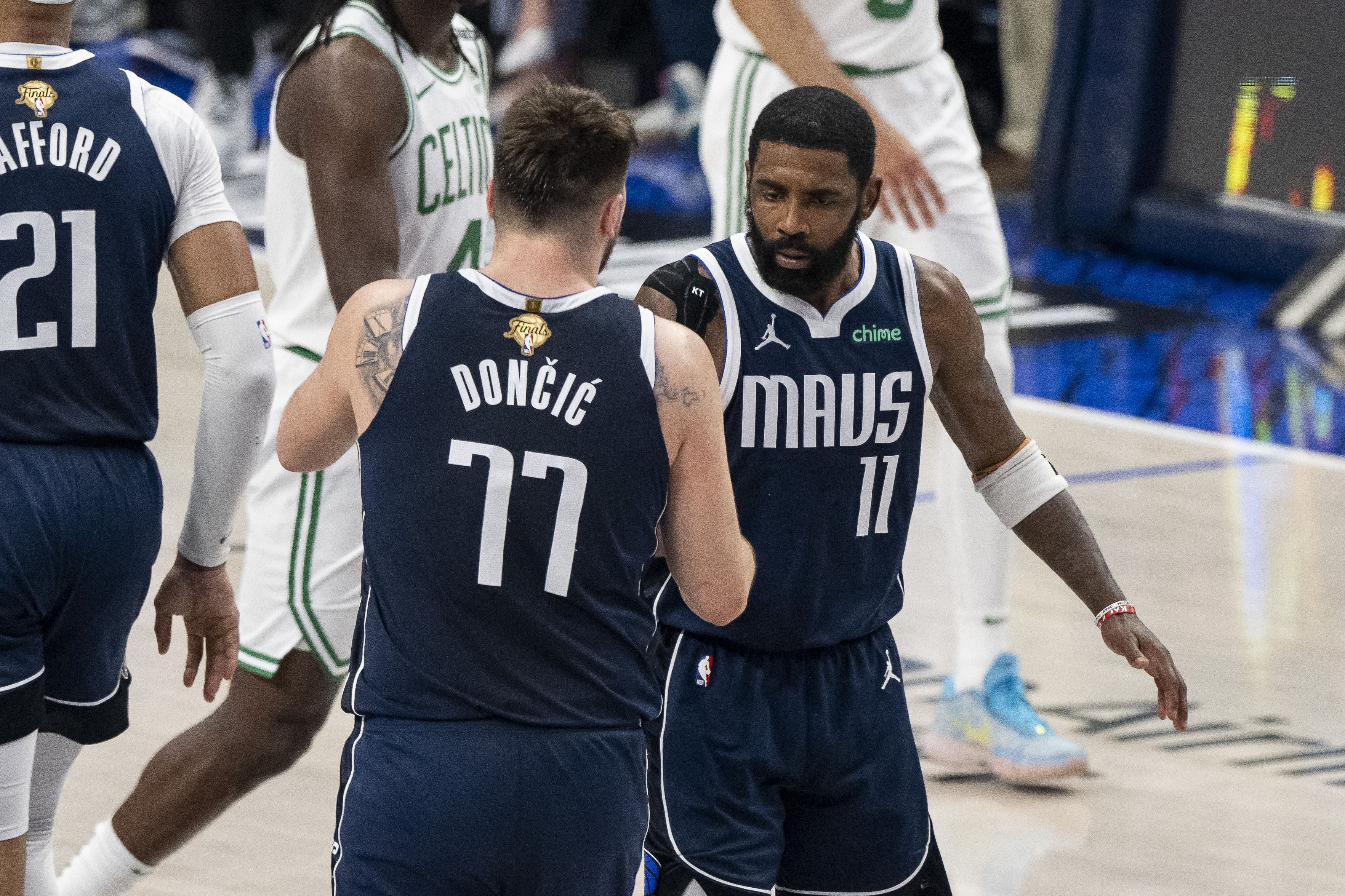 Dallas Mavericks guard Kyrie Irving and guard Luka Doncic celebrate during a game between the Dallas Mavericks and the Boston Celtics in the 2024 NBA Finals at American Airlines Center. Photo Credit: Imagn