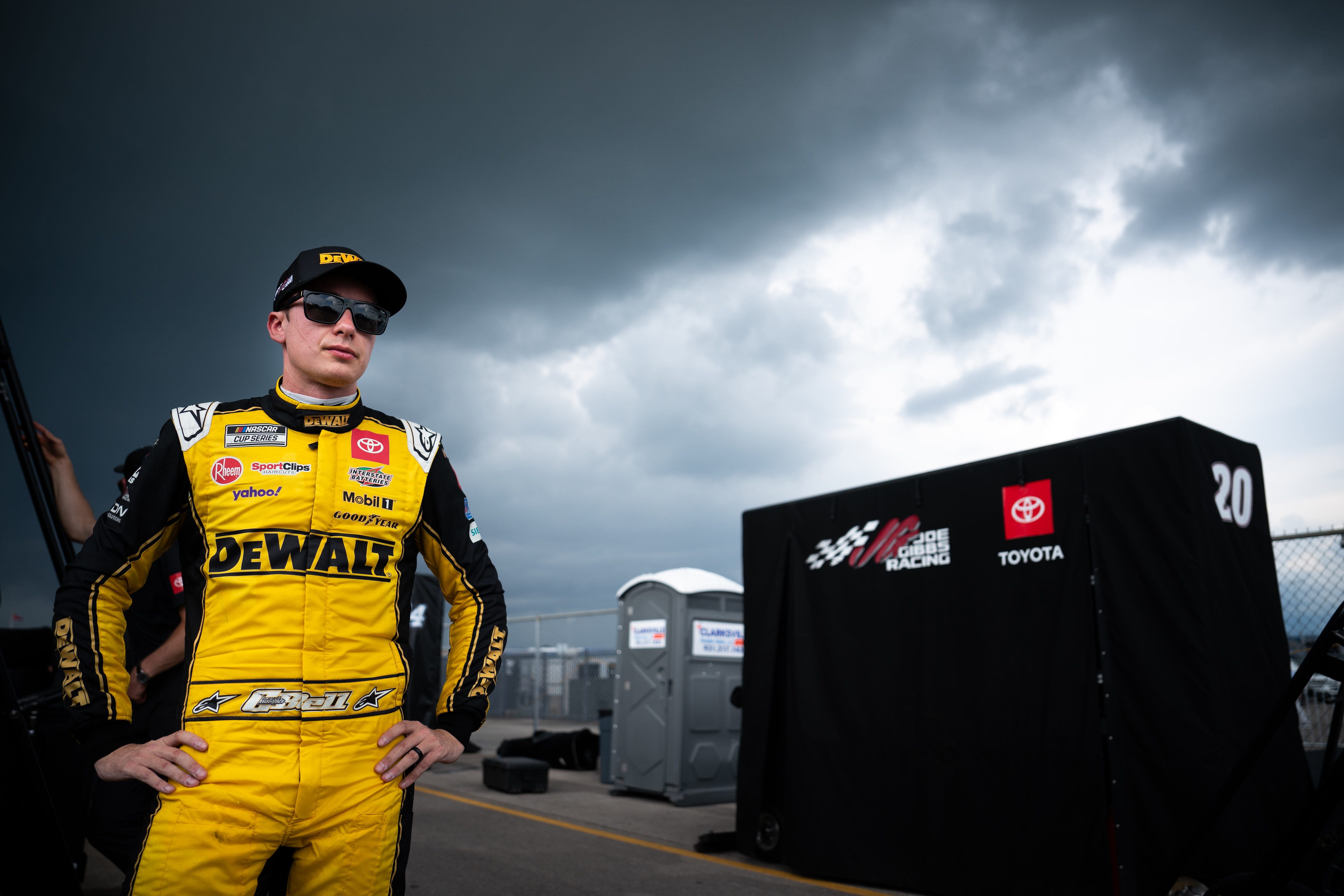 NASCAR Cup Series driver Christopher Bell stands with his crew after exiting his car due to a lightning delay during the Ally 400 at Nashville Superspeedway in Lebanon, Tenn., Sunday, June 30, 2024. - Source: Imagn