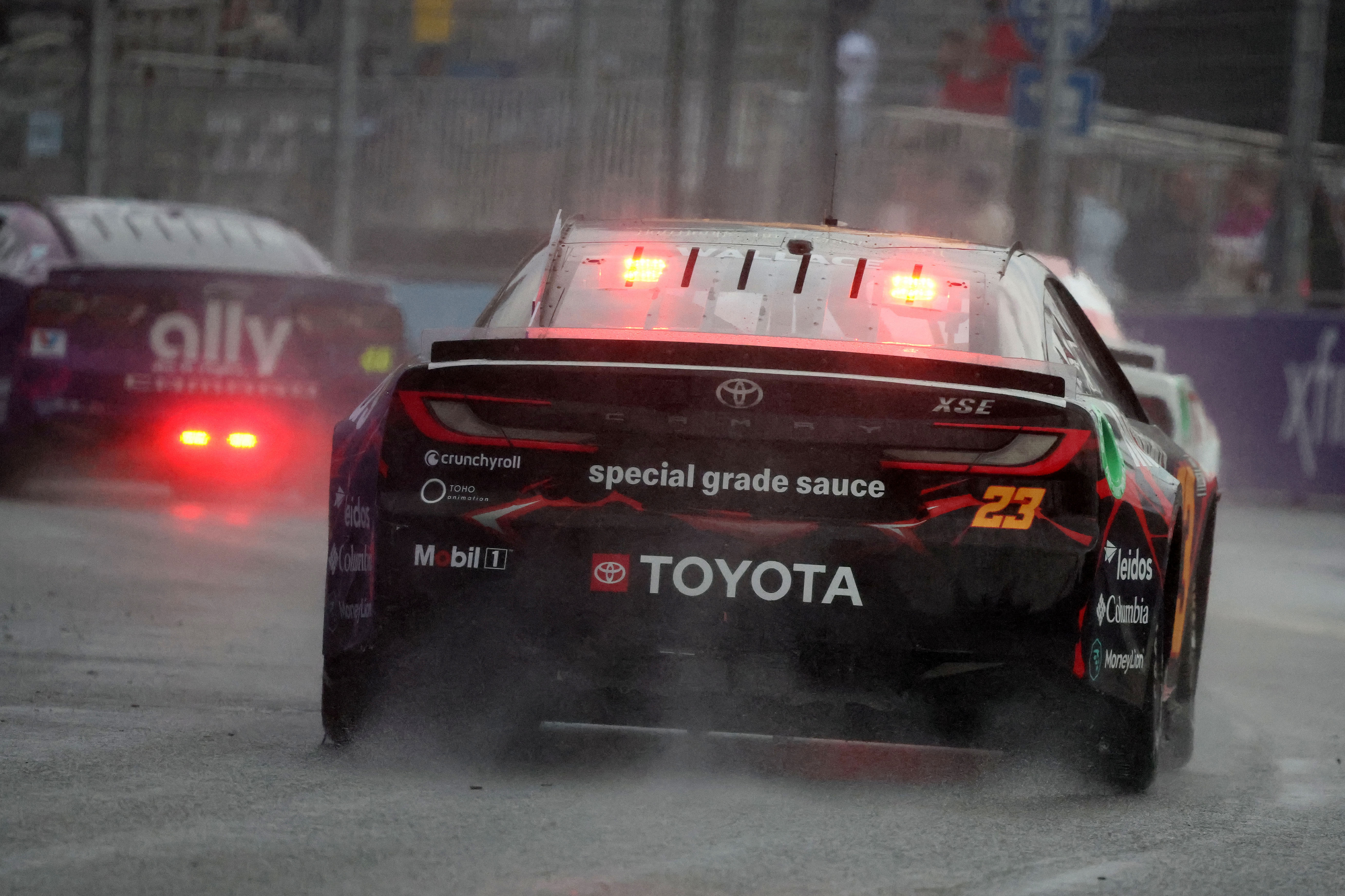 In Picture: Bubba Wallace (23) driving through the rain at the 2024 Grant Park 165 - Source: Imagn