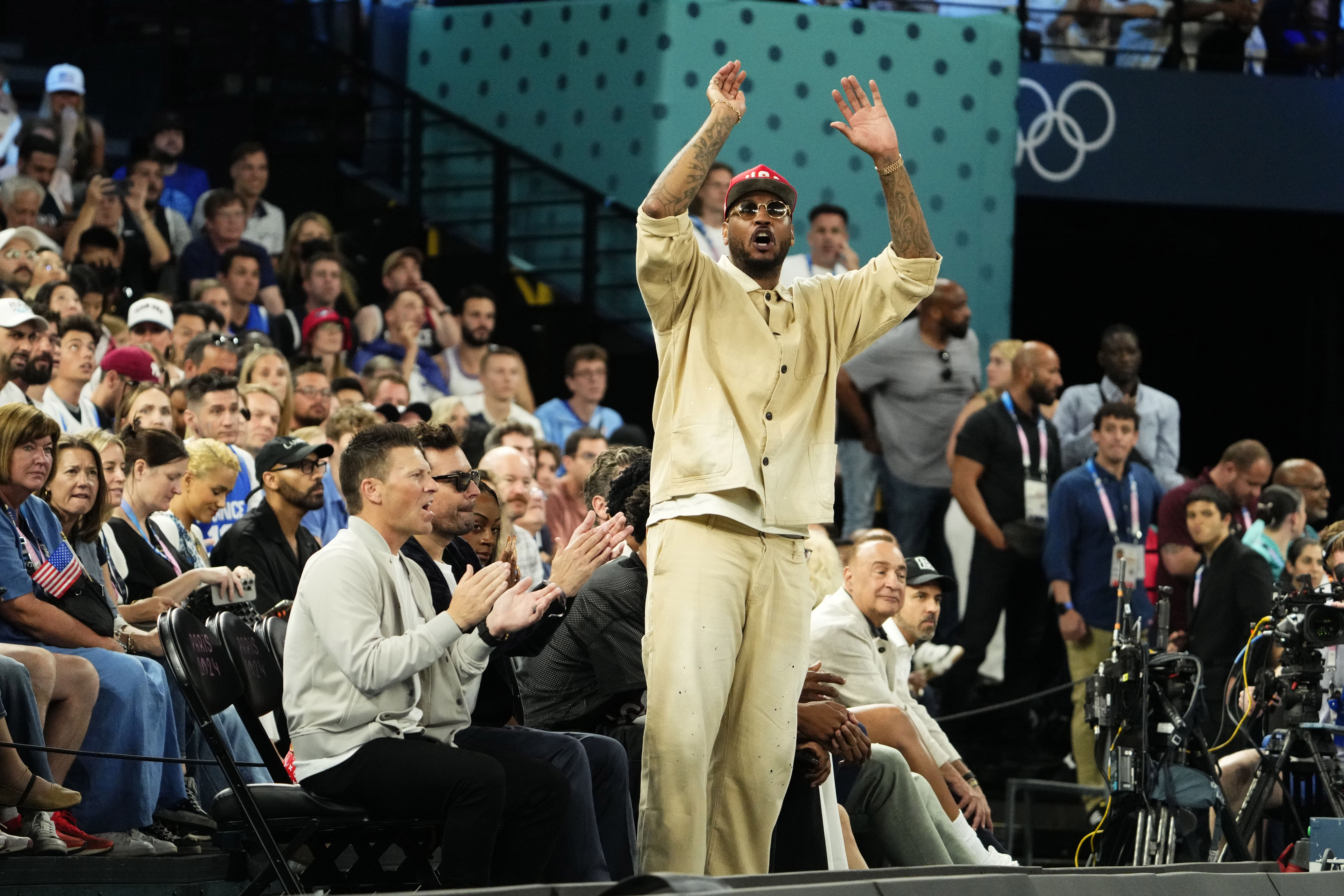 Carmelo Anthony cheers against France in the men&#039;s basketball gold medal game during the Paris 2024 Olympic Summer Games. Photo Credit: Imagn