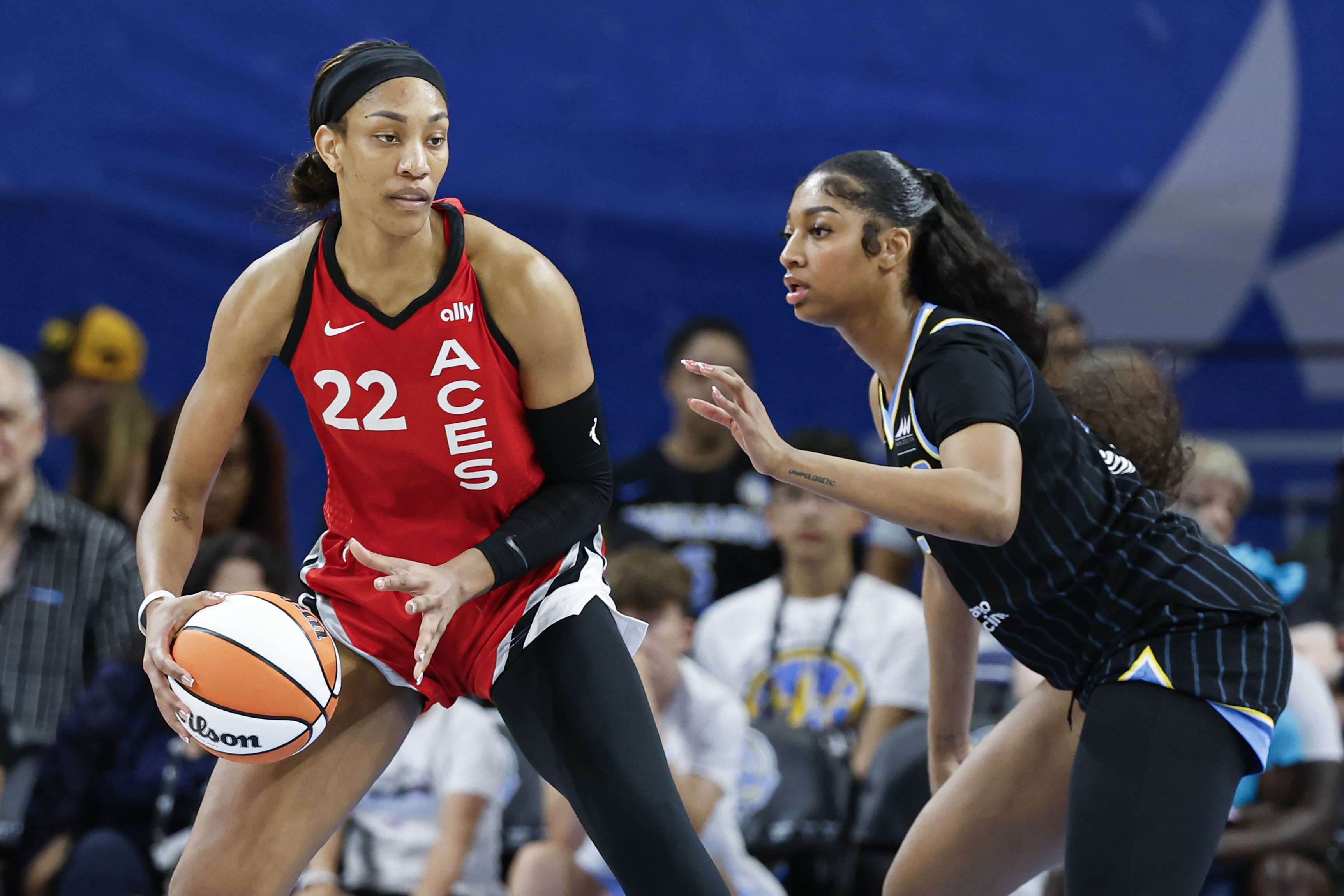 Las Vegas Aces center A&#039;ja Wilson is defended by Chicago Sky forward Angel Reese at Wintrust Arena. Photo Credit: Imagn