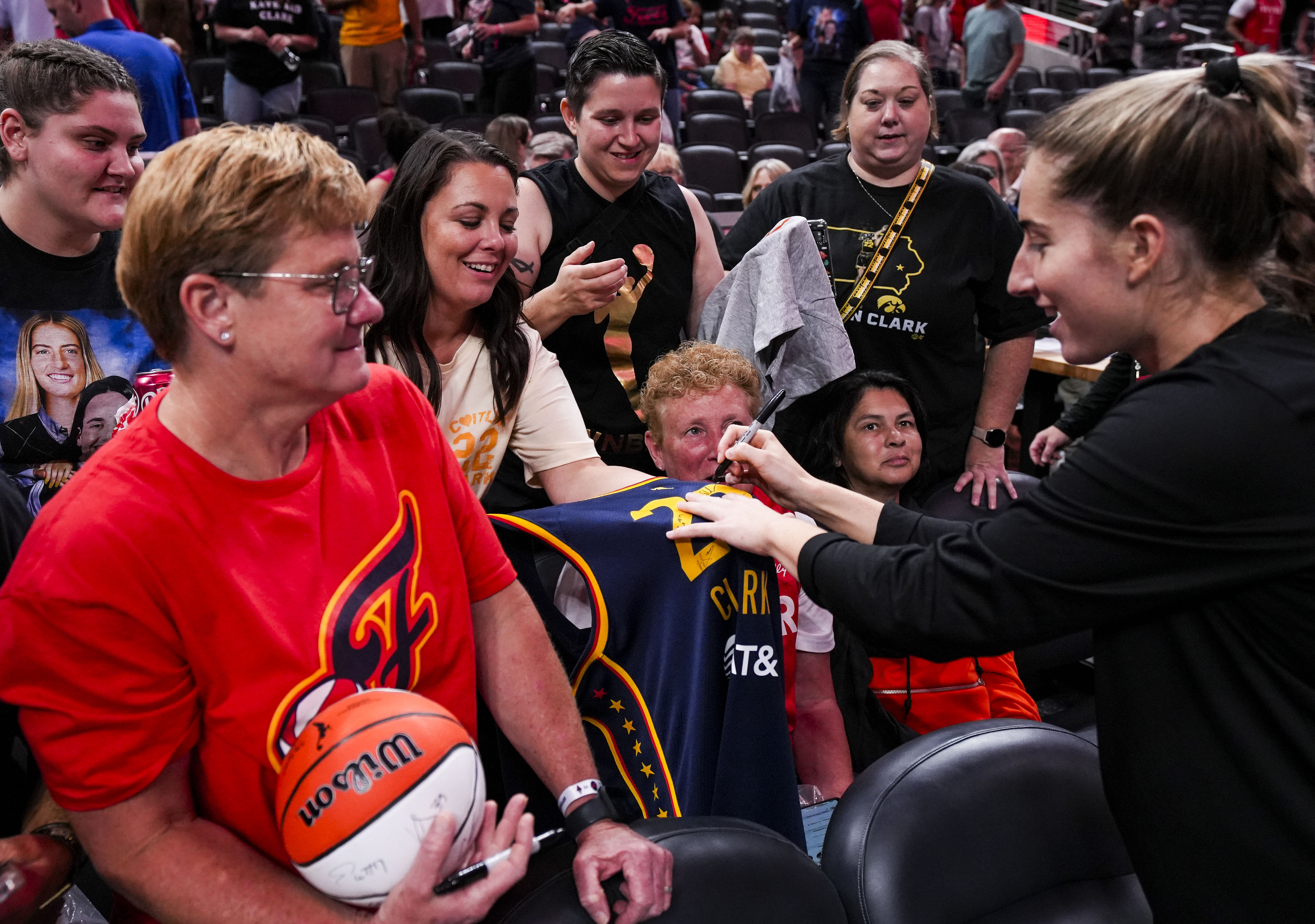 Sep 11, 2024; Indianapolis, Indiana, USA; Las Vegas Aces guard Kate Martin (20) signs Indiana Fever merchandise Wednesday, Sept. 11, 2024, during a game between the Indiana Fever and the Las Vegas Aces at Gainbridge Fieldhouse in Indianapolis. The Aces defeated the Fever, 86-75. Mandatory Credit: Grace Smith - Source: Imagn