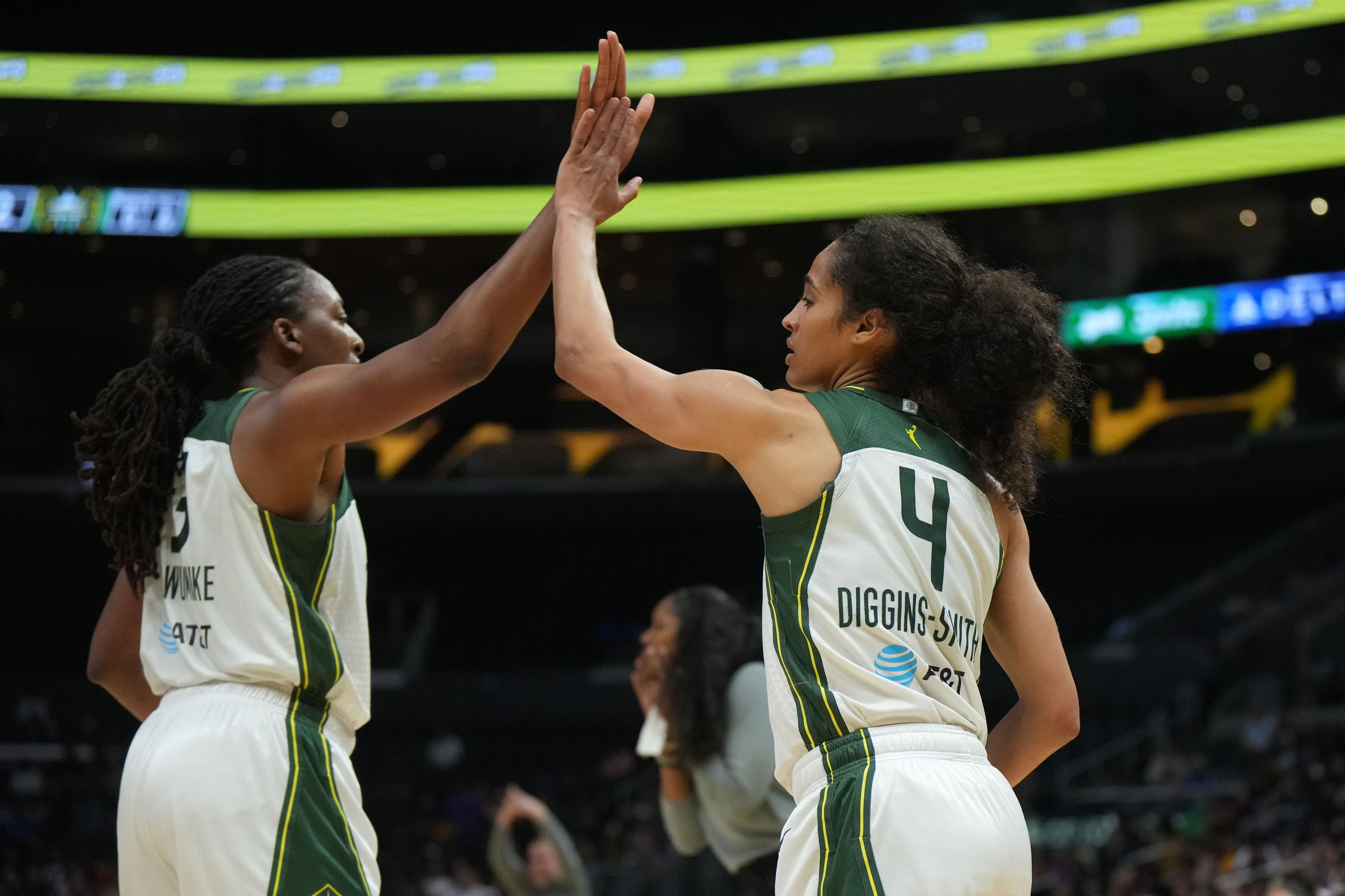 Sep 11, 2024; Los Angeles, California, USA; Seattle Storm forward Nneka Ogwumike (3) and guard Skylar Diggins-Smith (4) celebrate against the LA Sparks in the second half at Crypto.com Arena. Mandatory Credit: Kirby Lee-Imagn Images - Source: Imagn