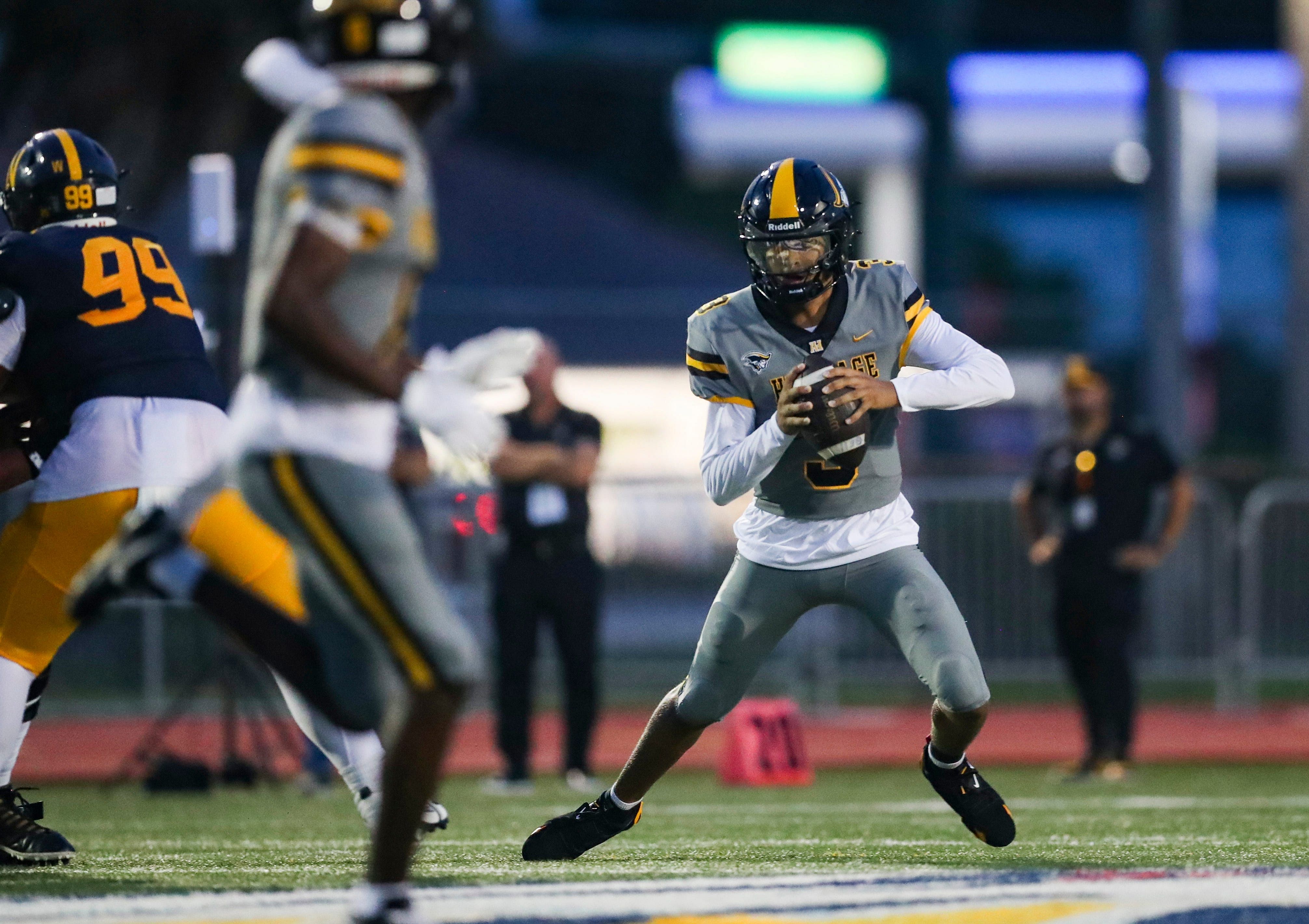 American Heritage Patriots quarterback Dia Bell (3) scrambles in the backfield during the first quarter of a game against the Naples Golden Eagles at Staver Field - Source: Imagn