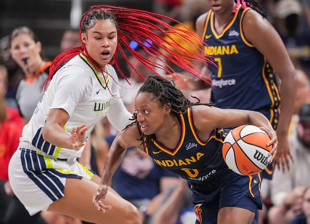 Sep 15, 2024; Indianapolis, Indiana, USA; Indiana Fever guard Kelsey Mitchell (0) rushes up the court against Dallas Wings forward Satou Sabally (0) at Gainbridge Fieldhouse. Mandatory Credit: Grace Hollars/USA TODAY Network via Imagn Images - Source: Imagn