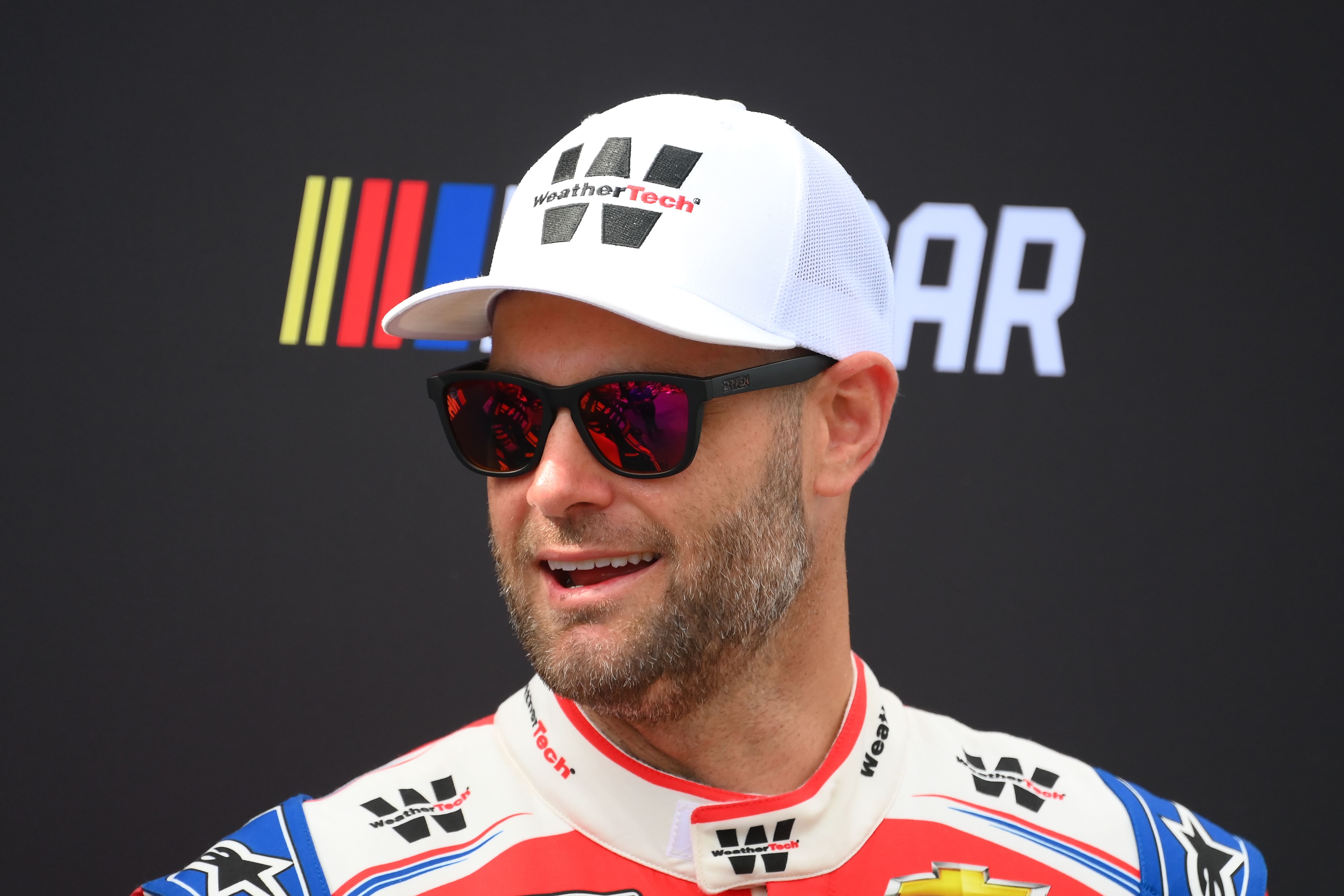 Sep 15, 2024; Watkins Glen, New York, USA; NASCAR Cup Series driver Shane van Gisbergen (16) looks on prior to the start of the Go Bowling at The Glen at Watkins Glen International. Mandatory Credit: Rich Barnes-Imagn Images - Source: Imagn