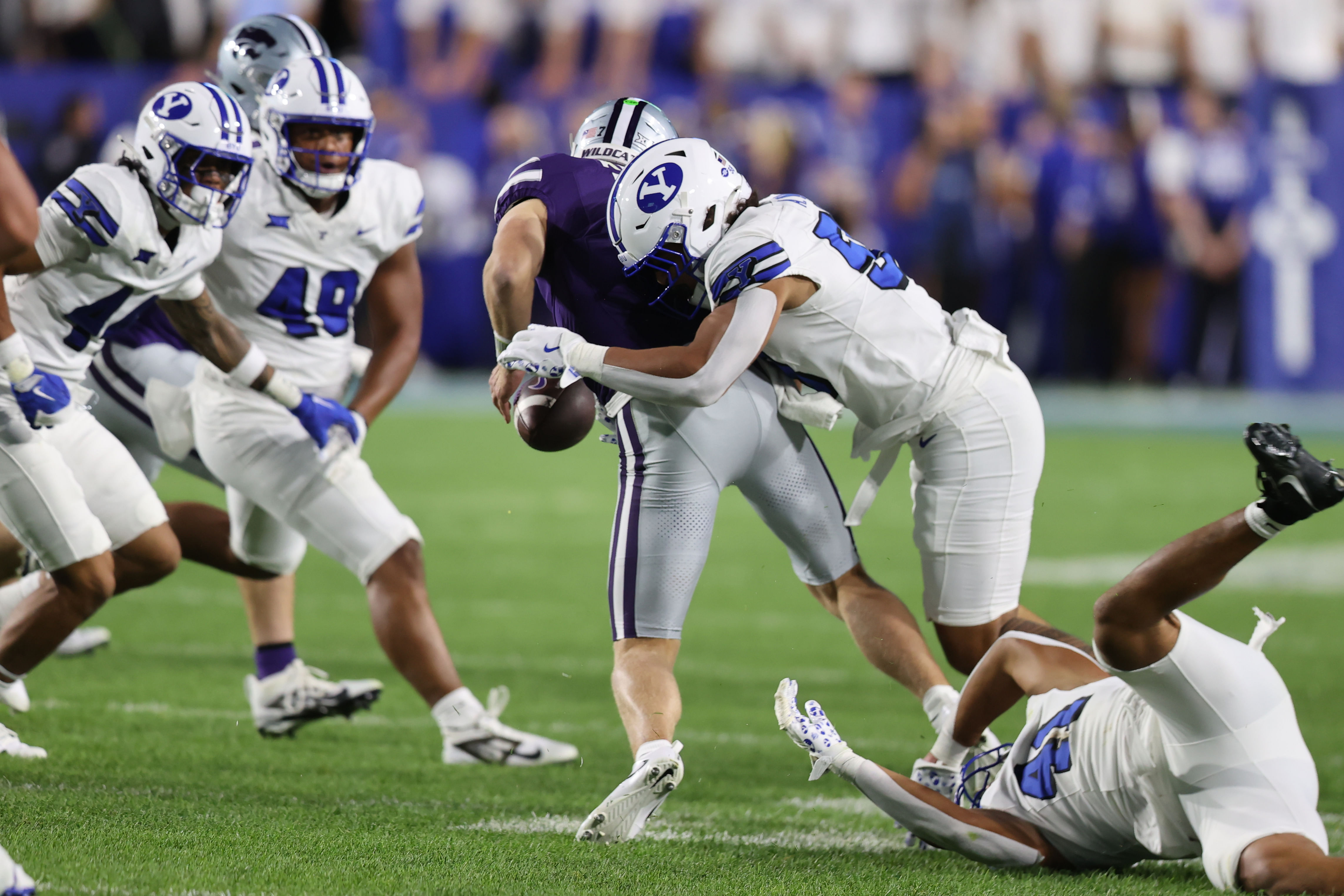 LB Aisea Moa, here forcing a fumble, has left BYU for Michigan State in the portal. (Photo Credit: IMAGN)