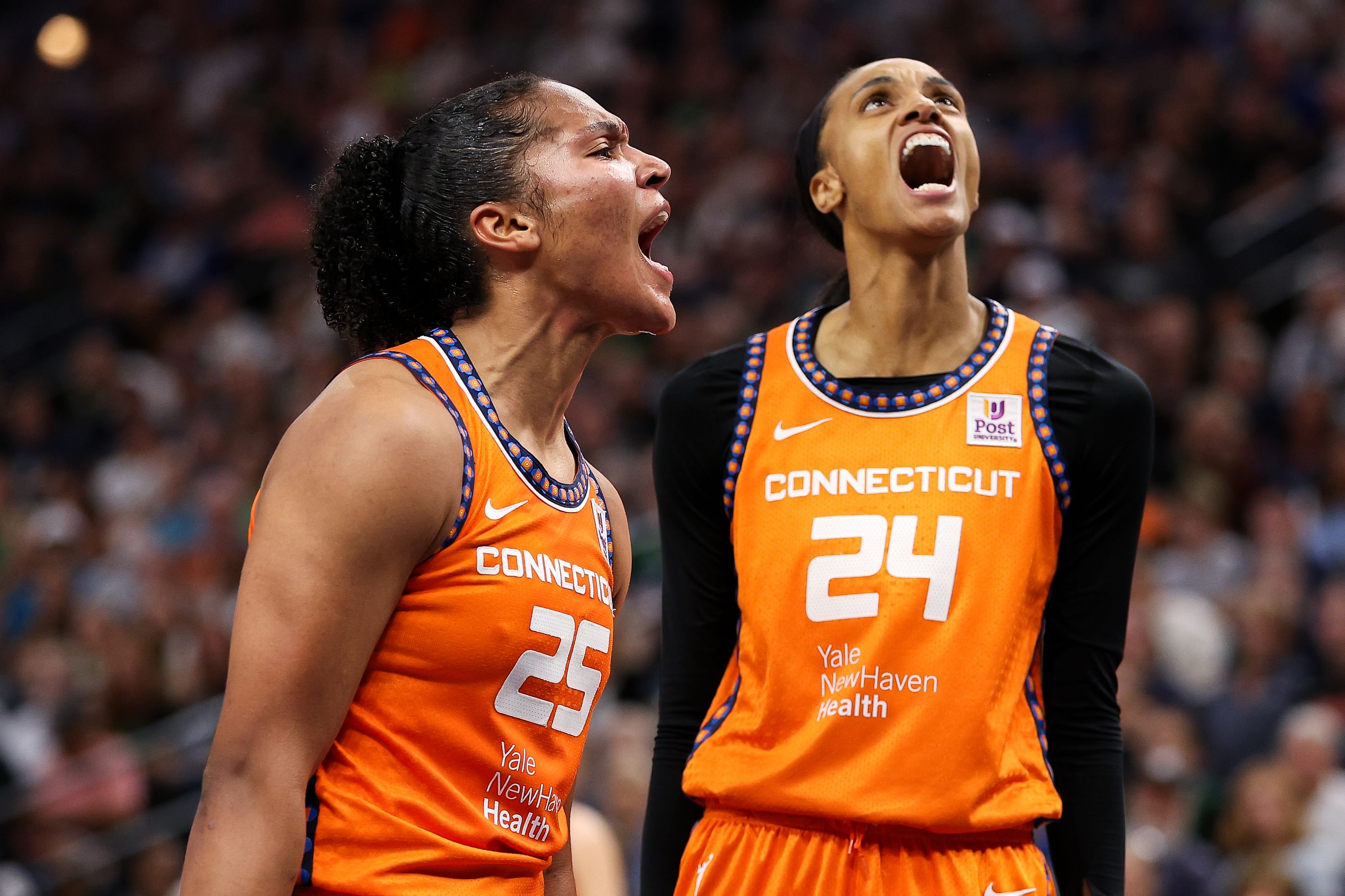 Connecticut Sun forward Alyssa Thomas celebrates her shot with forward DeWanna Bonner at Target Center. Photo Credit: Imagn