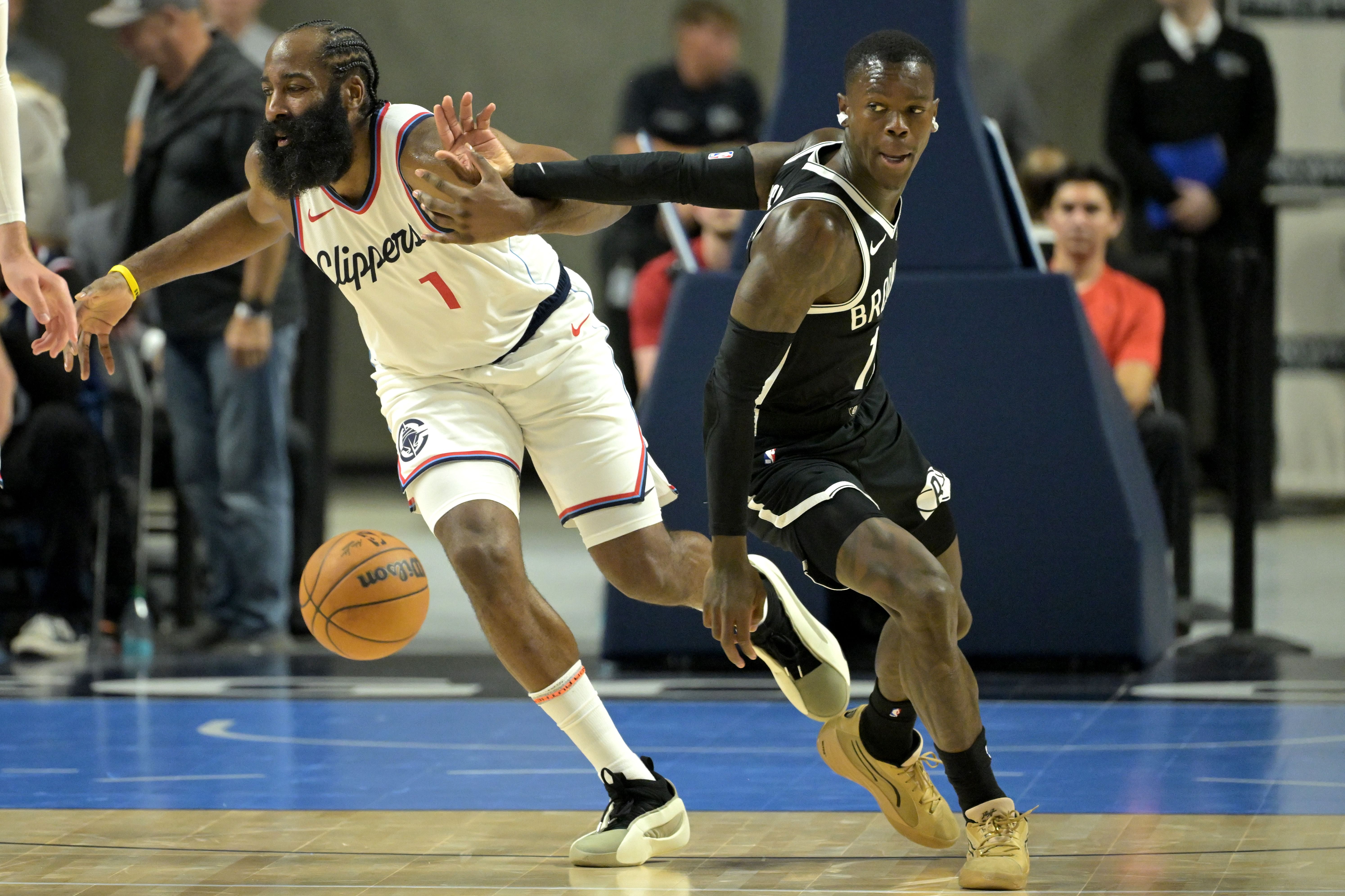 Oct 8, 2024; Oceanside, California, USA; Los Angeles Clippers guard James Harden (1) is pressured by Brooklyn Nets guard Dennis Schroder (17) and loses control of the ball in the first half of a preseason game at Frontwave Arena. Mandatory Credit: Jayne Kamin-Oncea-Imagn Images - Source: Imagn