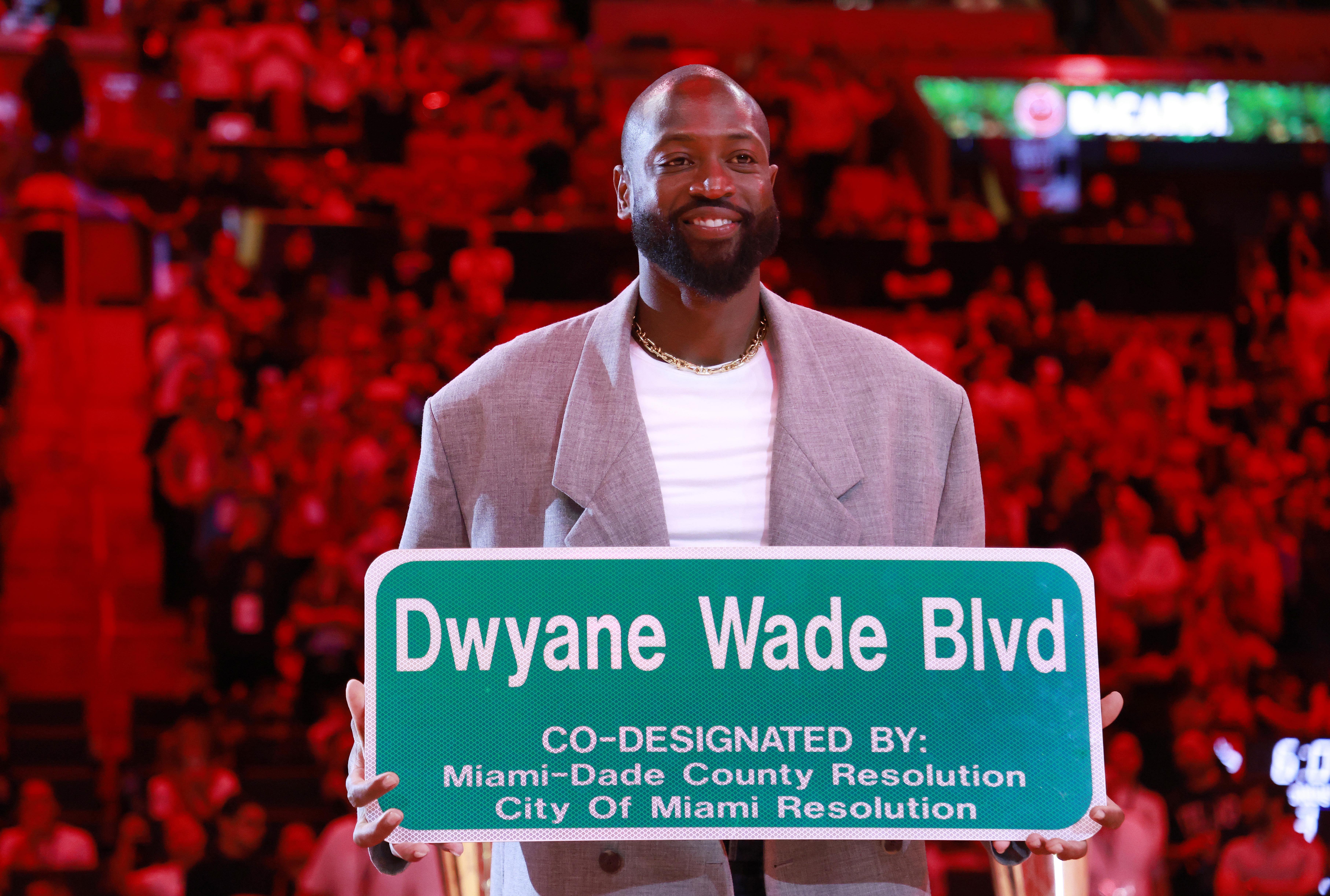 Former Miami Heat guard Dwyane Wade is honored with &#039;Dwyane Wade Blvd&#039; at halftime during a game against the Detroit Pistons at Kaseya Center. Photo Credit: Imagn