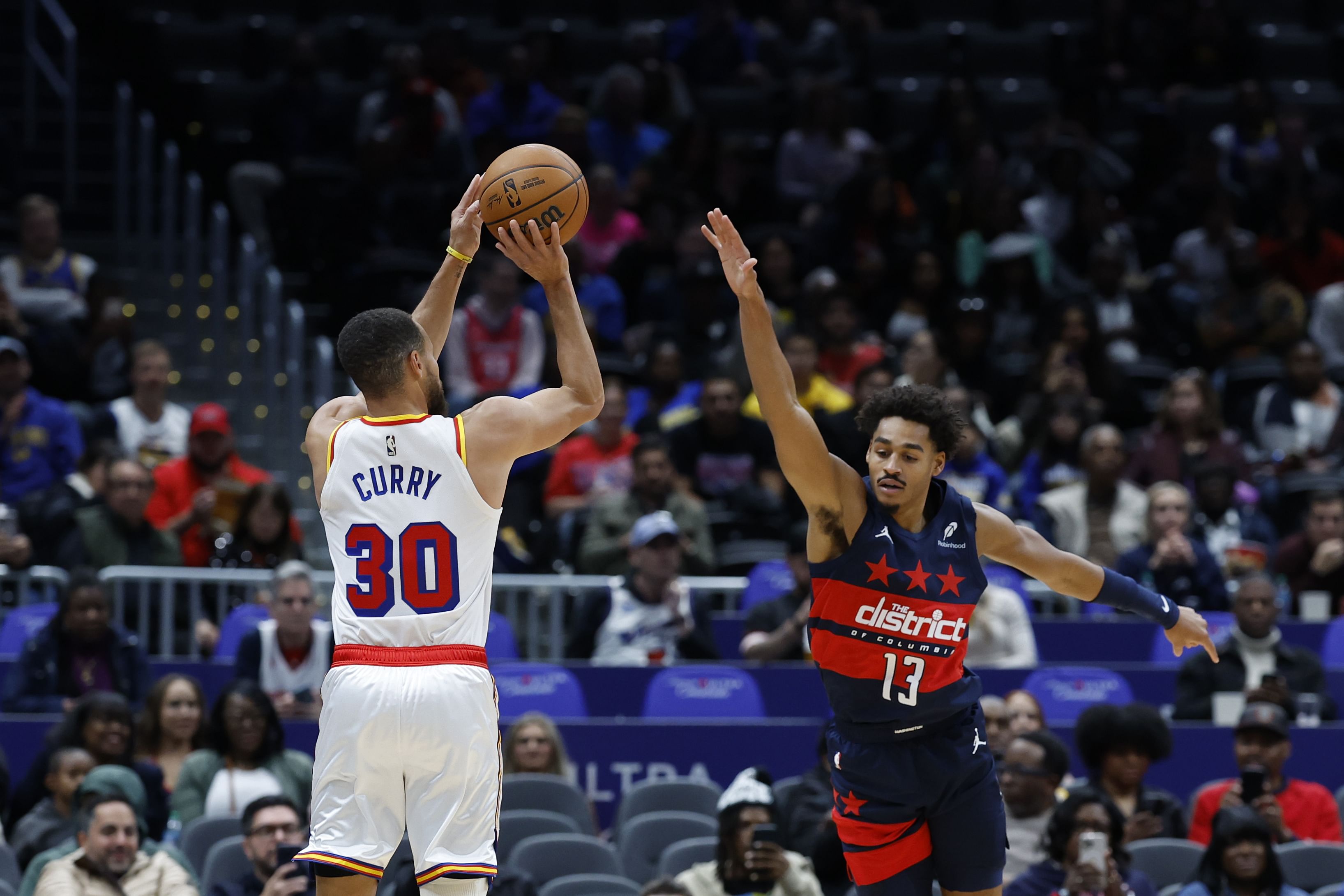 Golden State Warriors guard Stephen Curry shoots the ball over Washington Wizards guard Jordan Poole at Capital One Arena. Photo Credit: Imagn