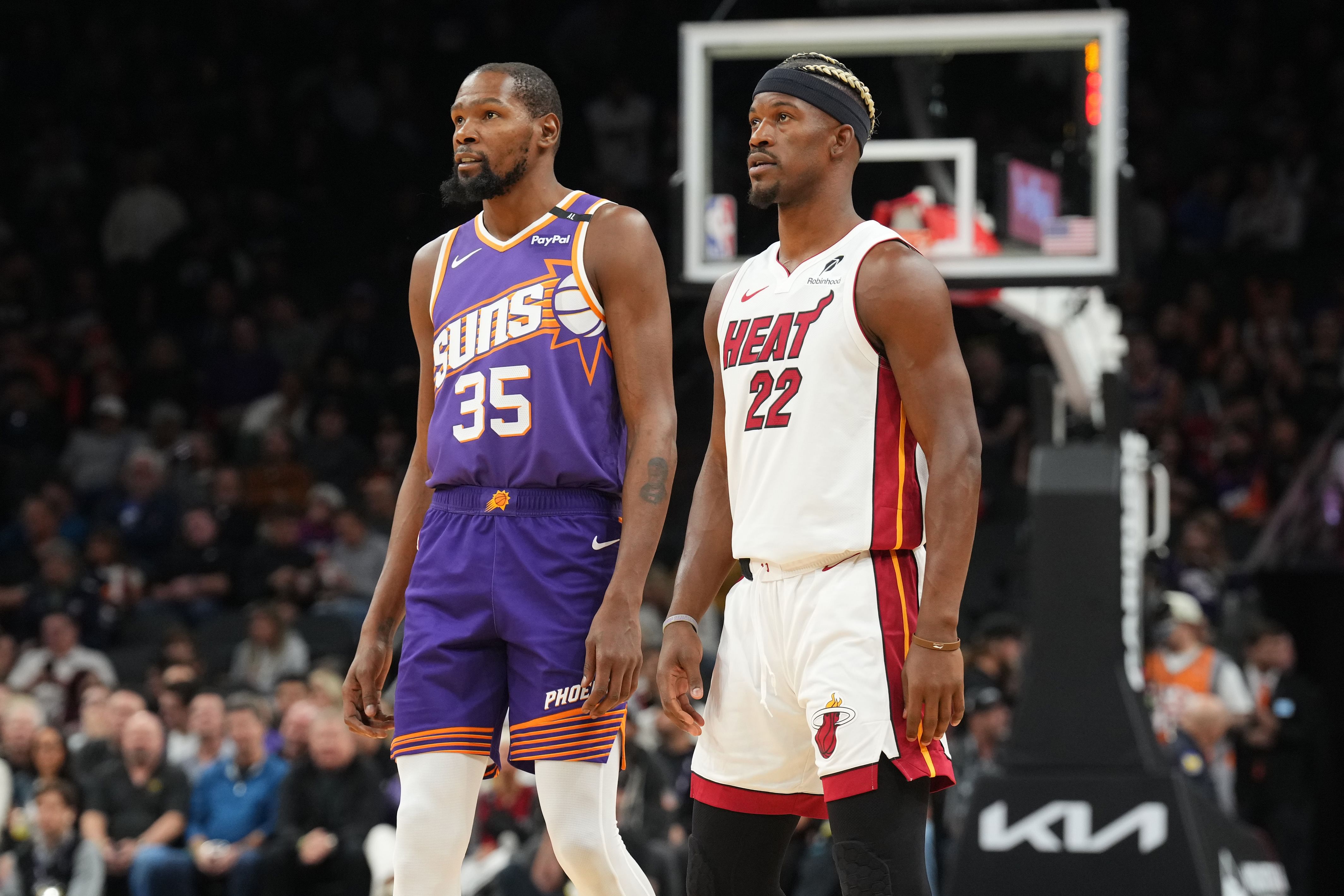 Nov 6, 2024; Phoenix, Arizona, USA; Phoenix Suns forward Kevin Durant (35) and Miami Heat forward Jimmy Butler (22)  - Source: Imagn