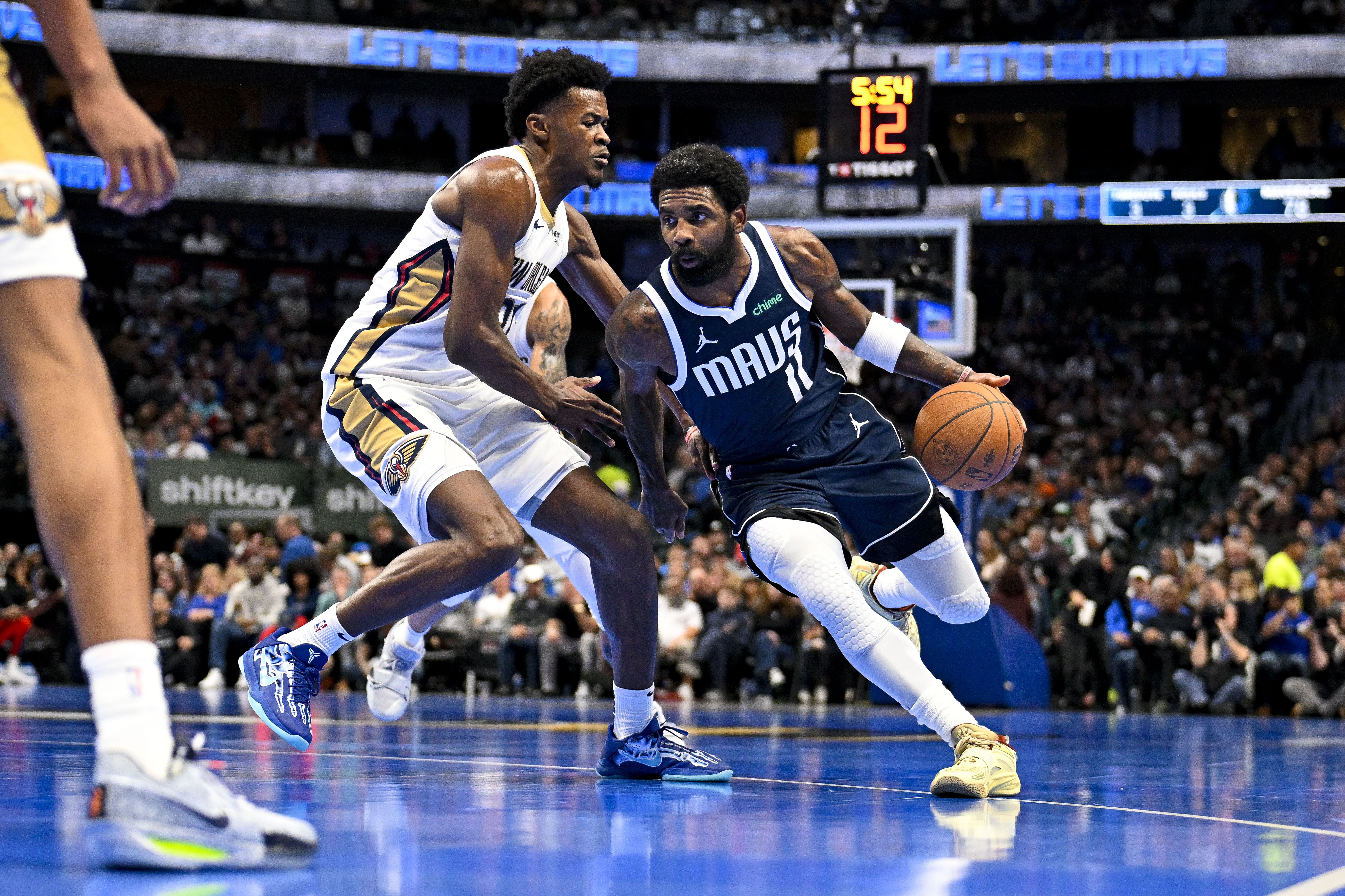 Dallas Mavericks guard Kyrie Irving drives to the basket past New Orleans Pelicans center Yves Missi at the American Airlines Center. Photo Credit: Imagn